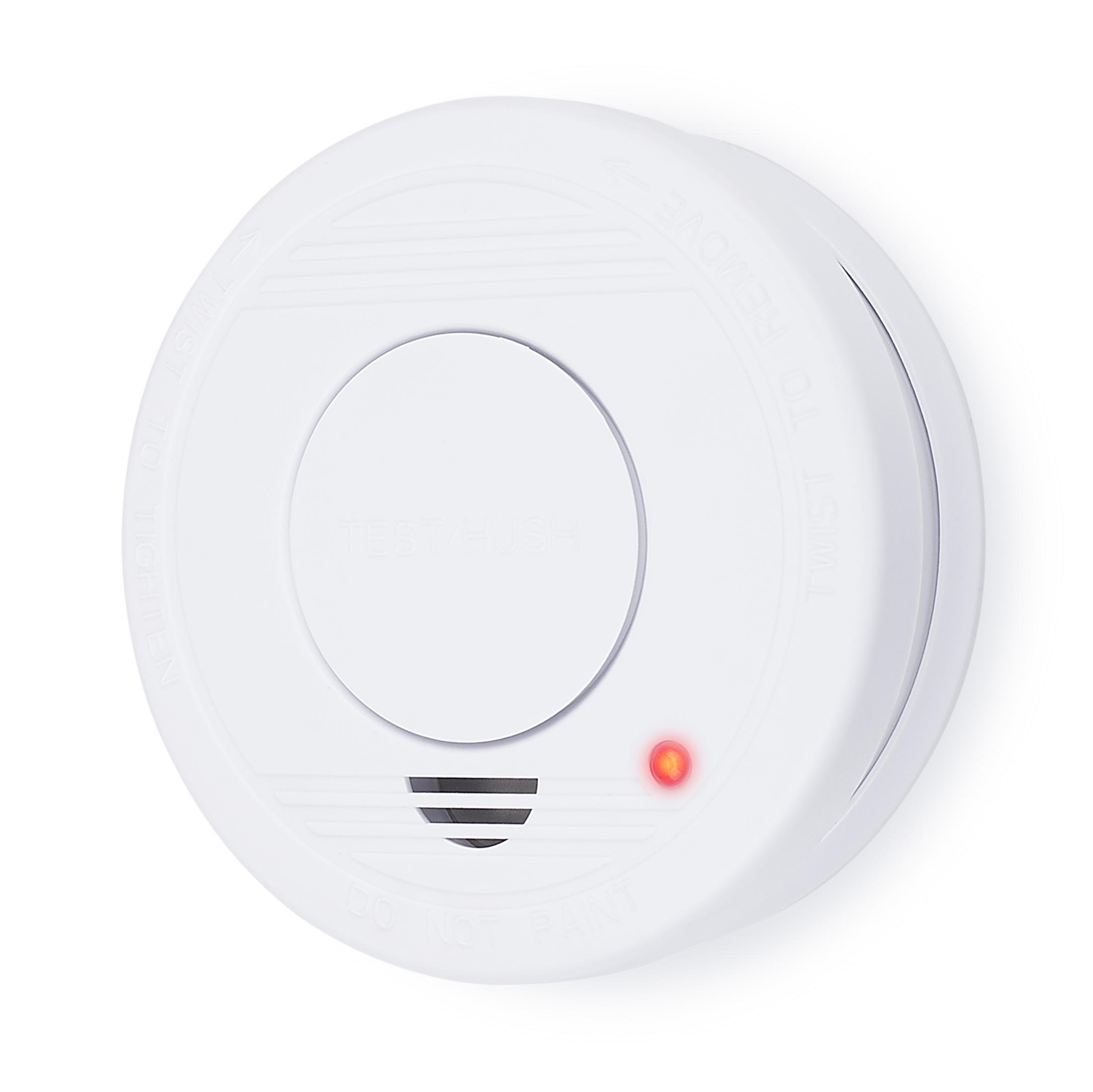 Biały czujnik dymu z czerwonym światłem. Czujnik jest okrągły i płaski.