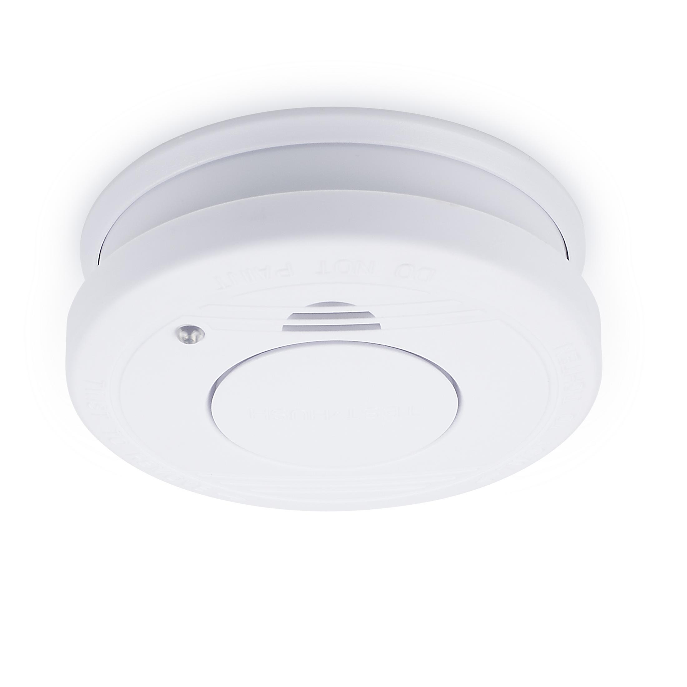 Biała czujka dymu na białym tle, zbliżenie.