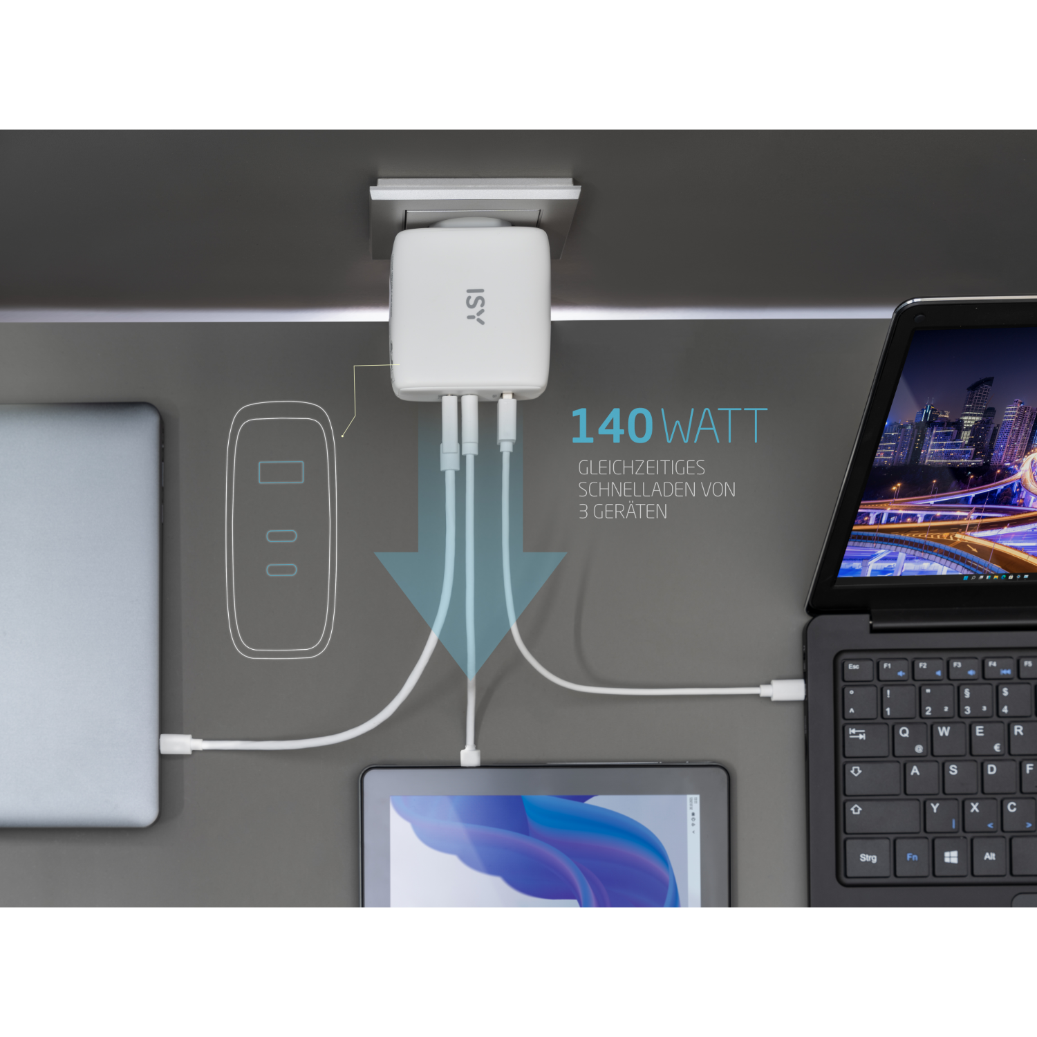 Ein Setup mit Laptop, Tablet und Ladegerät mit dem Text 140 Watt.