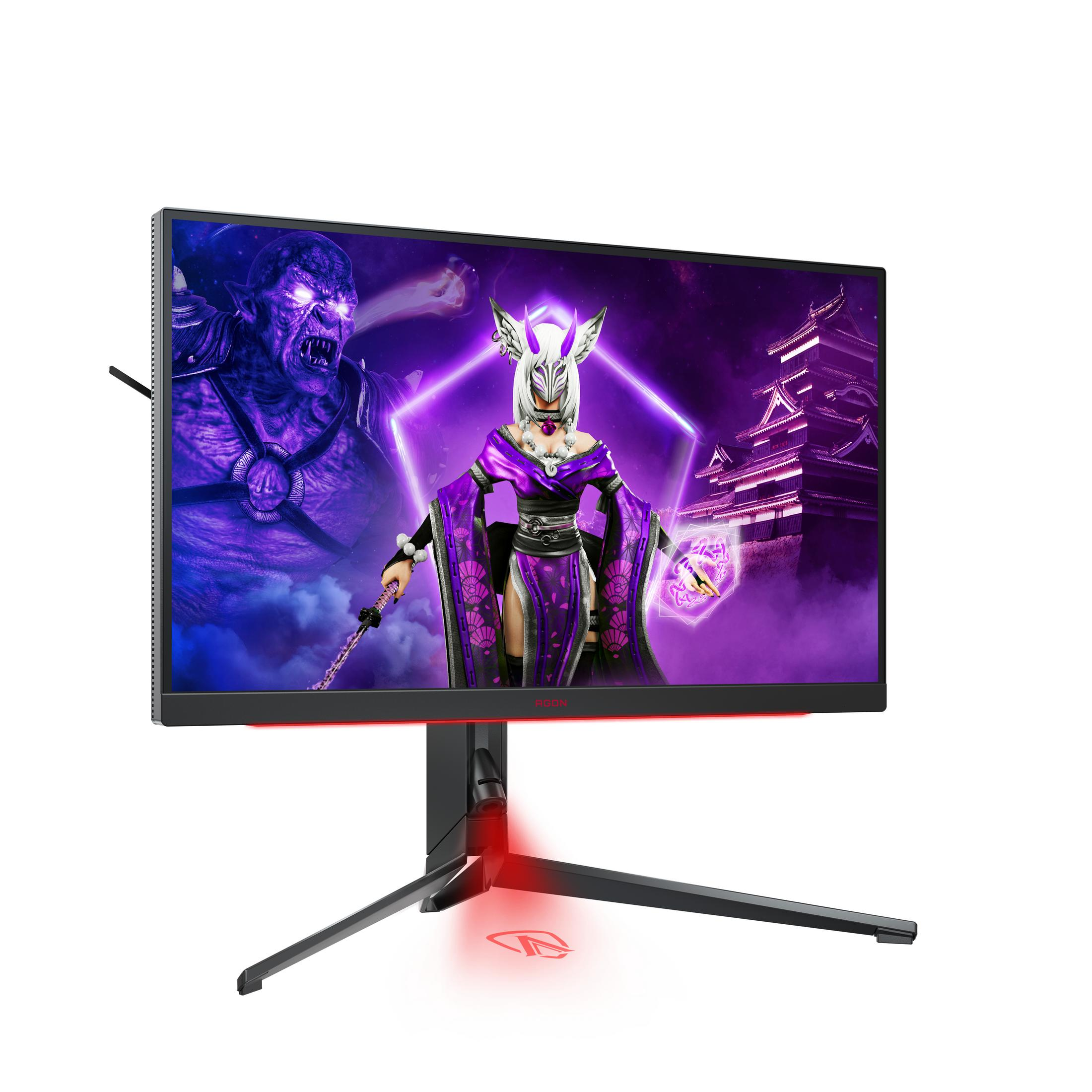 Un monitor da gioco mostra una scena di gioco a tema viola e un personaggio demone.
