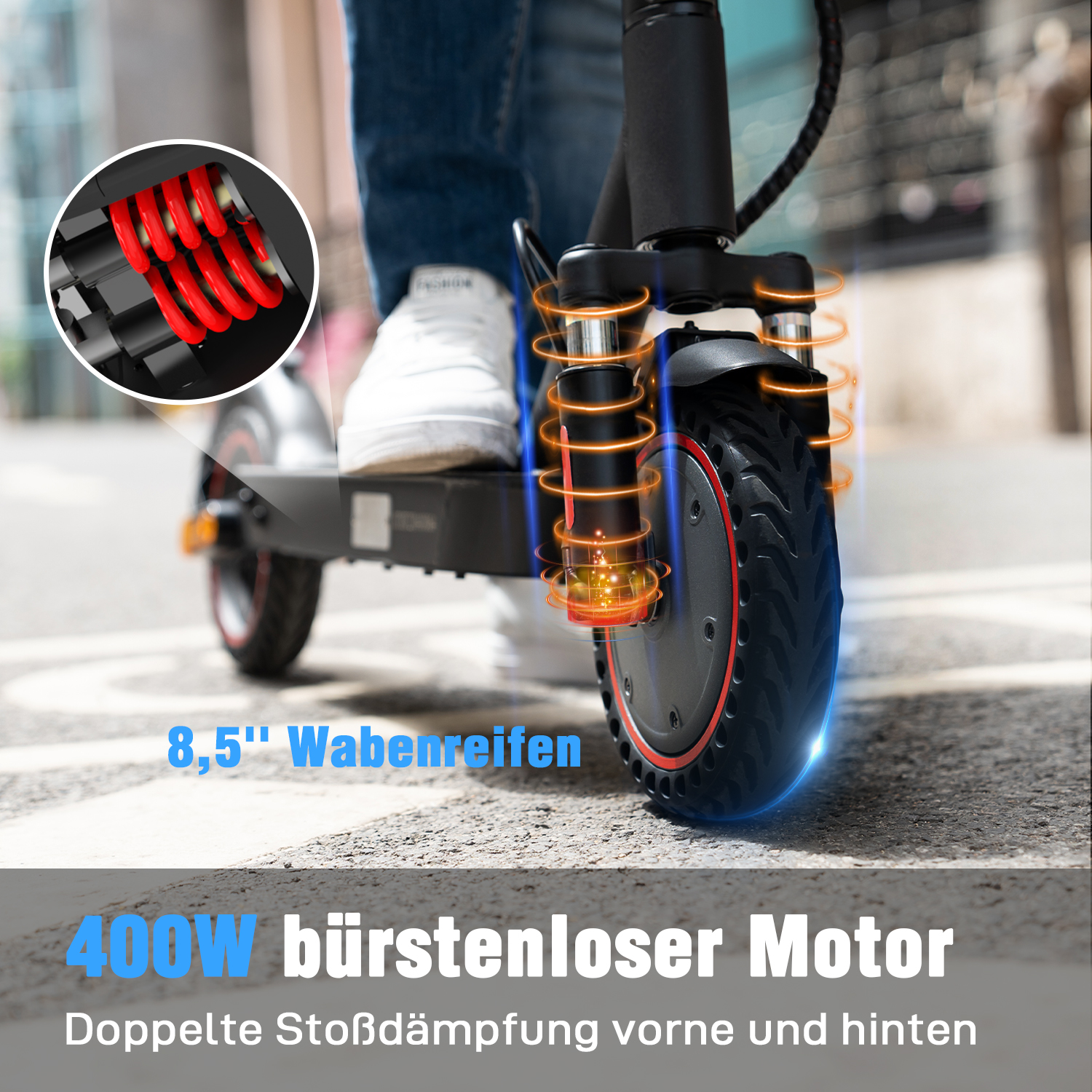 Gros plan de la roue de trottinette avec pneus en nid d'abeille de 8,5". Texte : moteur sans balais de 400W, double amorti.