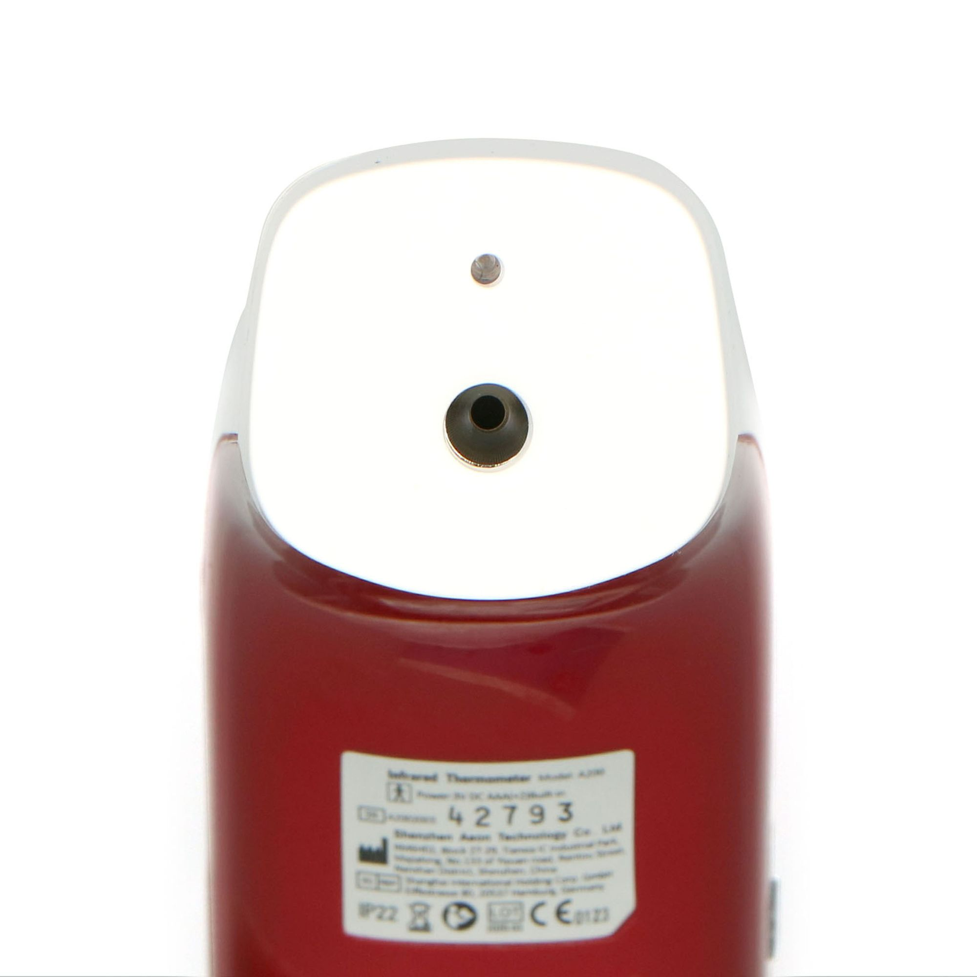 Infrarot-Thermometer. Rot und weiß. Hat ein Display und einen Knopf. Weißer Hintergrund.