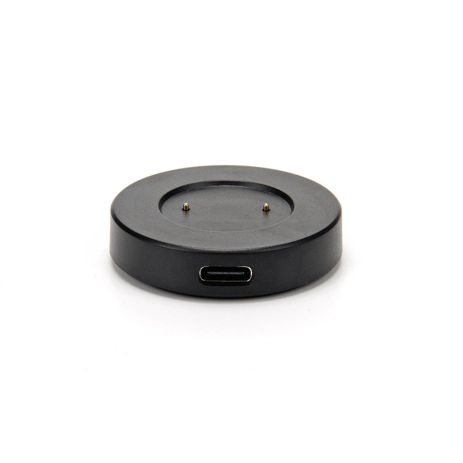 Ein schwarzes, kreisförmiges Smartwatch-Ladegerät mit USB-Anschluss. Zwei goldene Stifte sind auf der Ladefläche sichtbar.