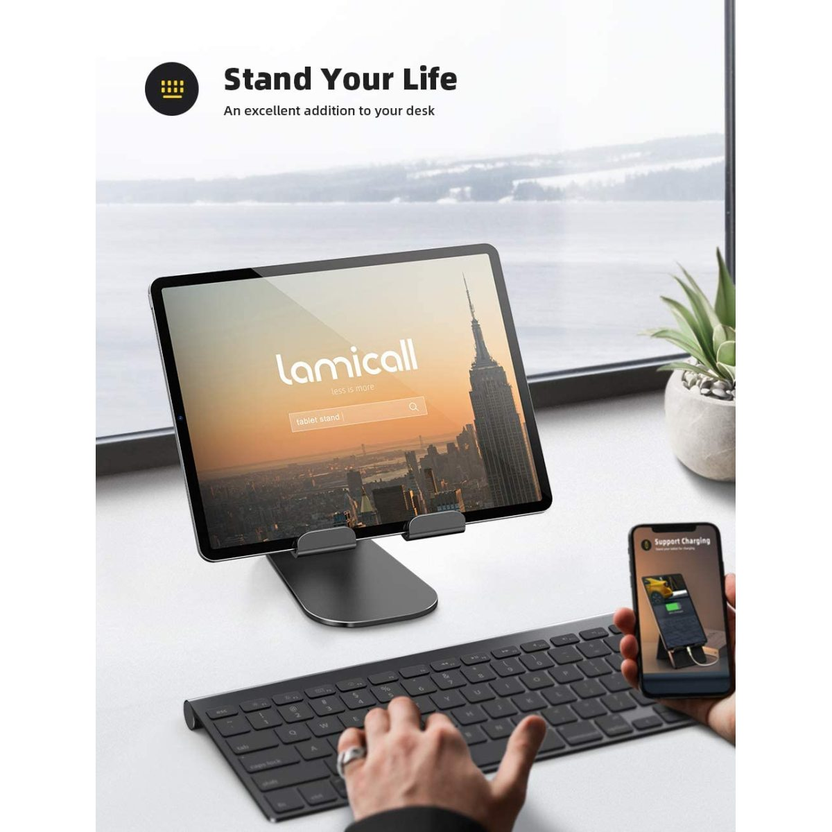 Ein Tablet auf einem Ständer mit Tastatur und Telefon. Text sagt, Steh dein Leben.