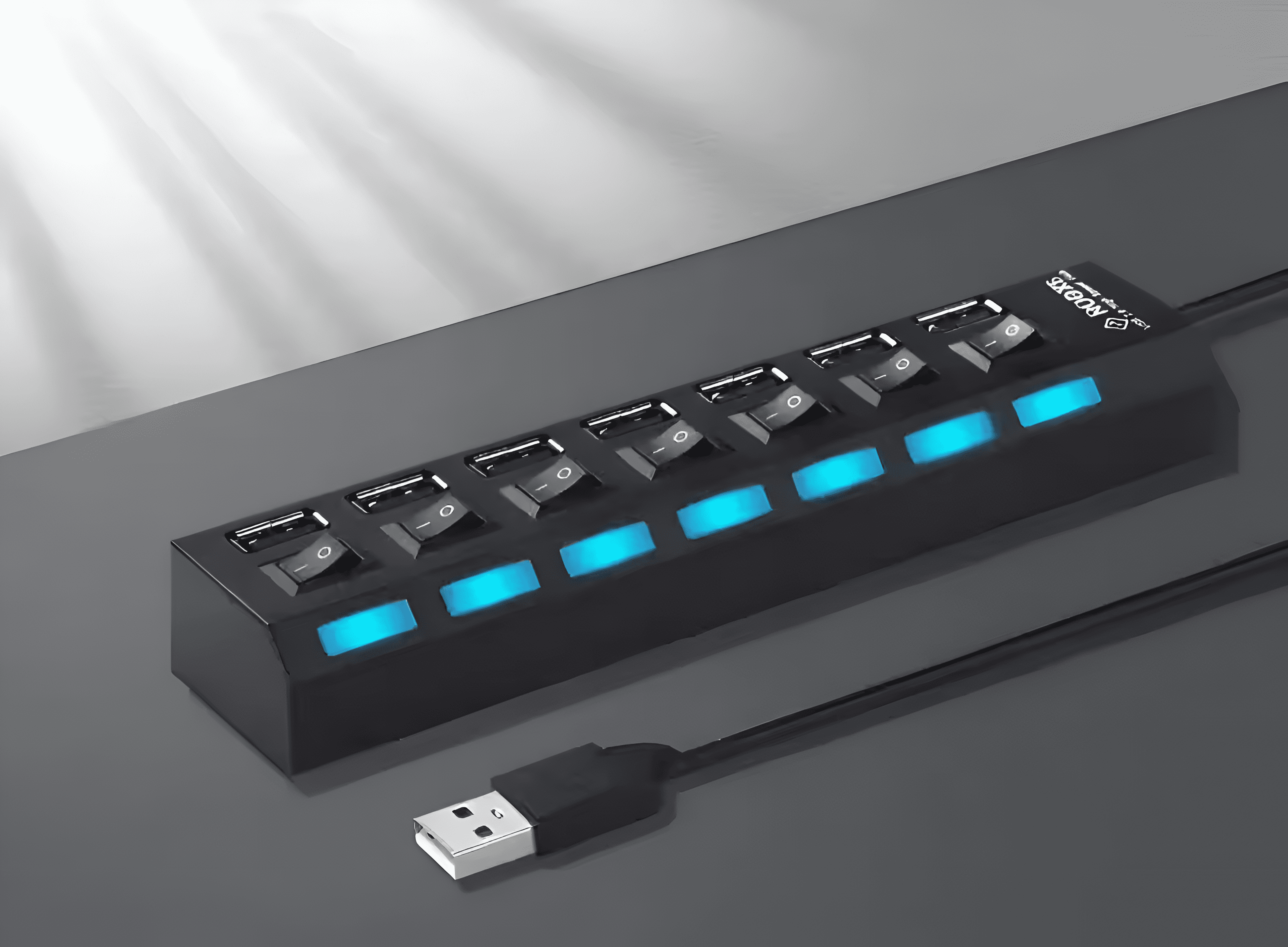 Concentrador USB negro con interruptores y luces azules. El concentrador tiene múltiples puertos USB.