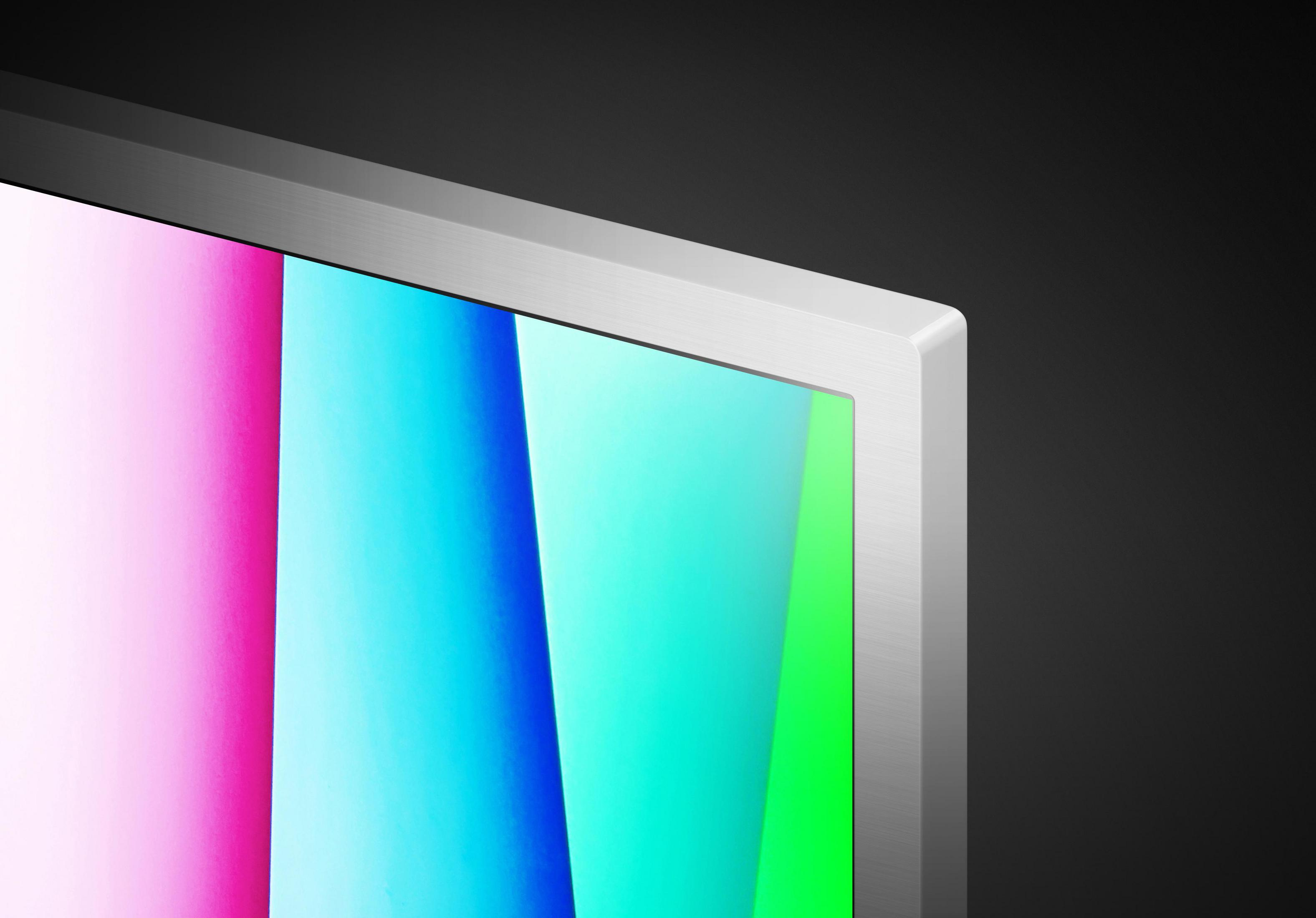 Zbliżenie rogu monitora ze srebrną ramką i kolorowym ekranem.