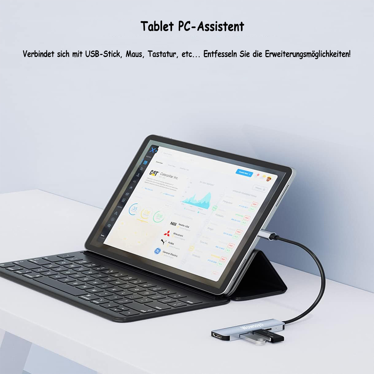 Tableta conectada a teclado y hub USB con ratón y USB en mesa blanca.