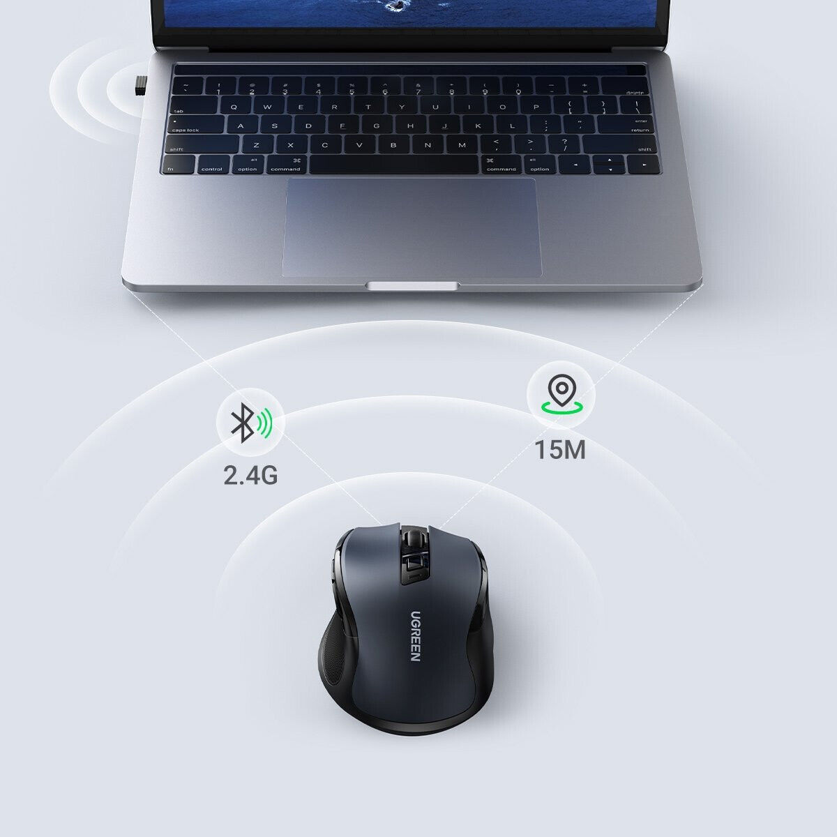 Schwarze Maus neben einem Laptop mit einem Funksymbol und dem Wort 2.4G.