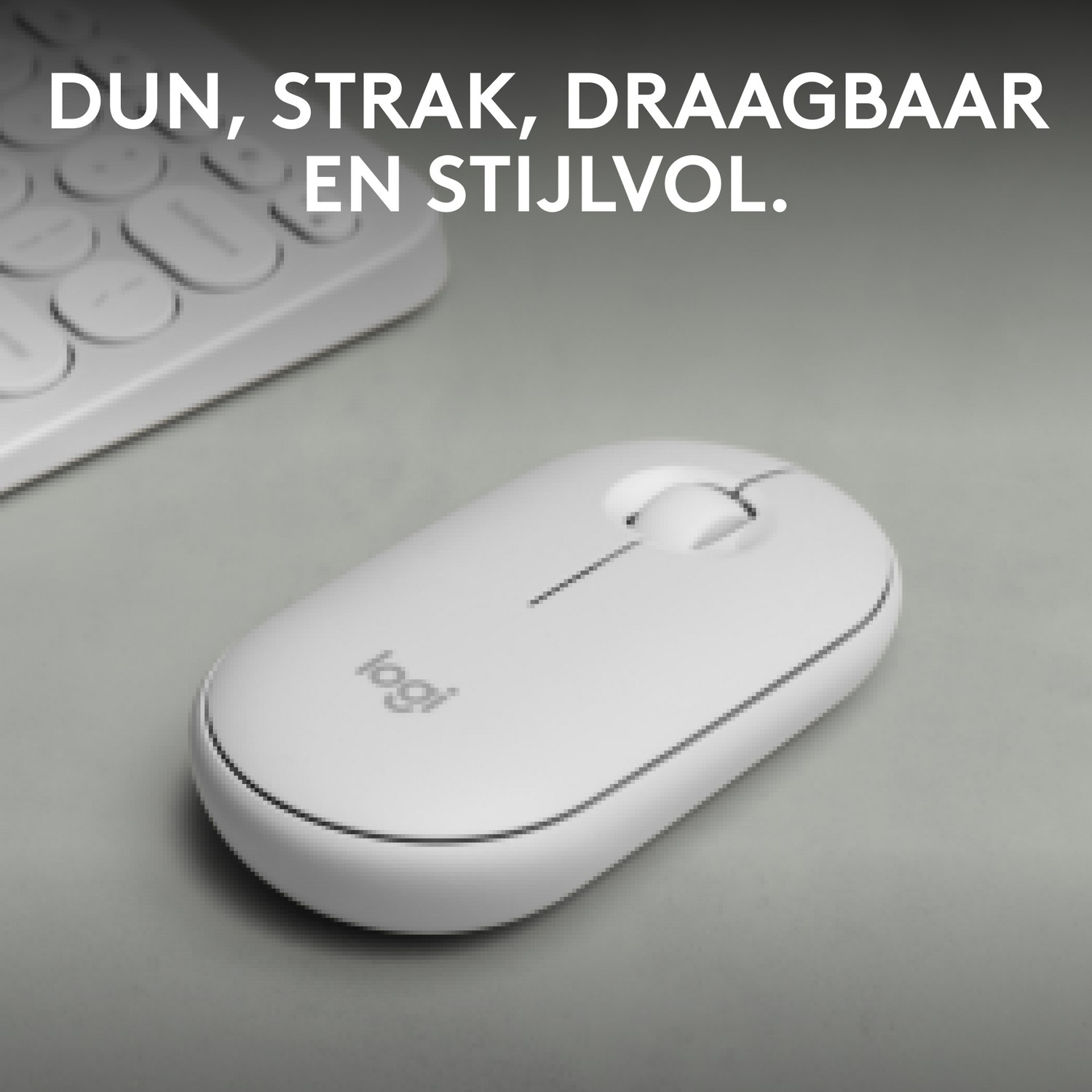 Mouse Logitech bianco su una superficie grigia.