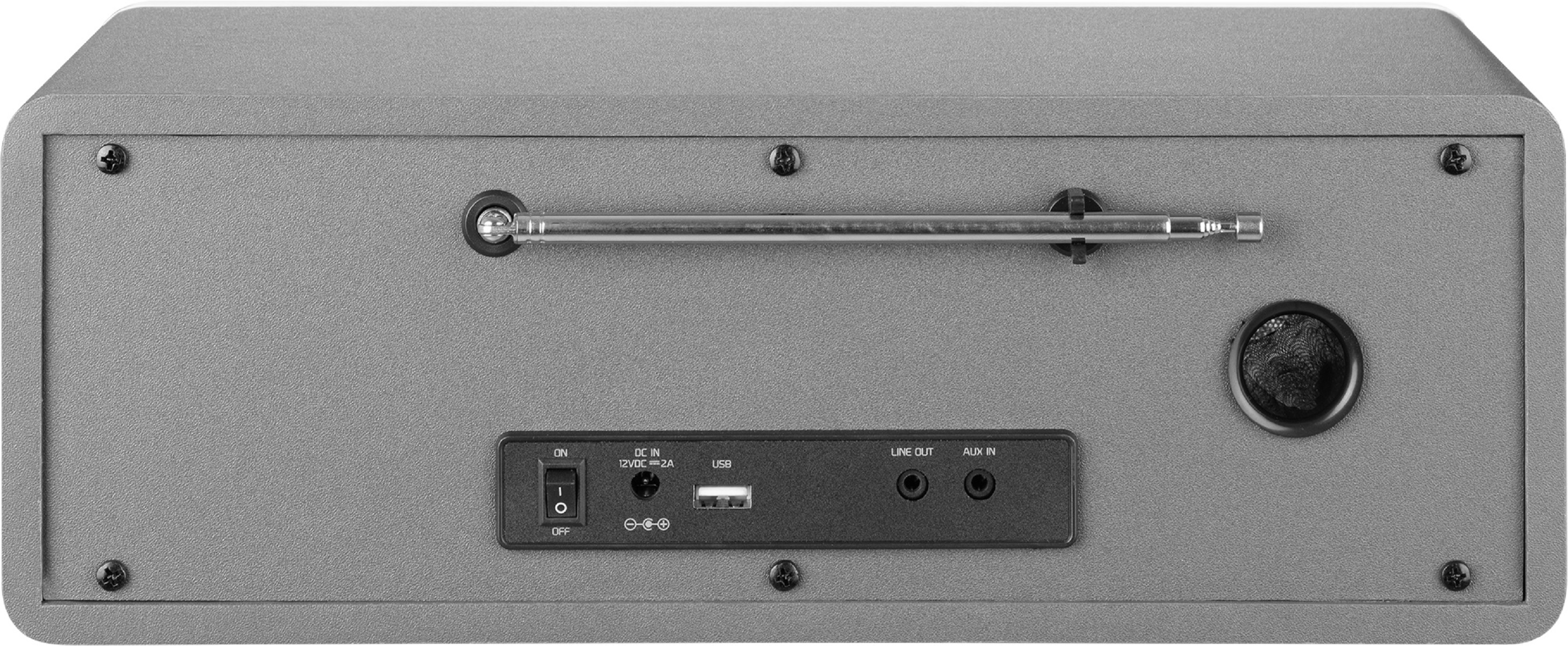 Retro di una radio grigia. Include antenna e varie porte. Sfondo scuro.