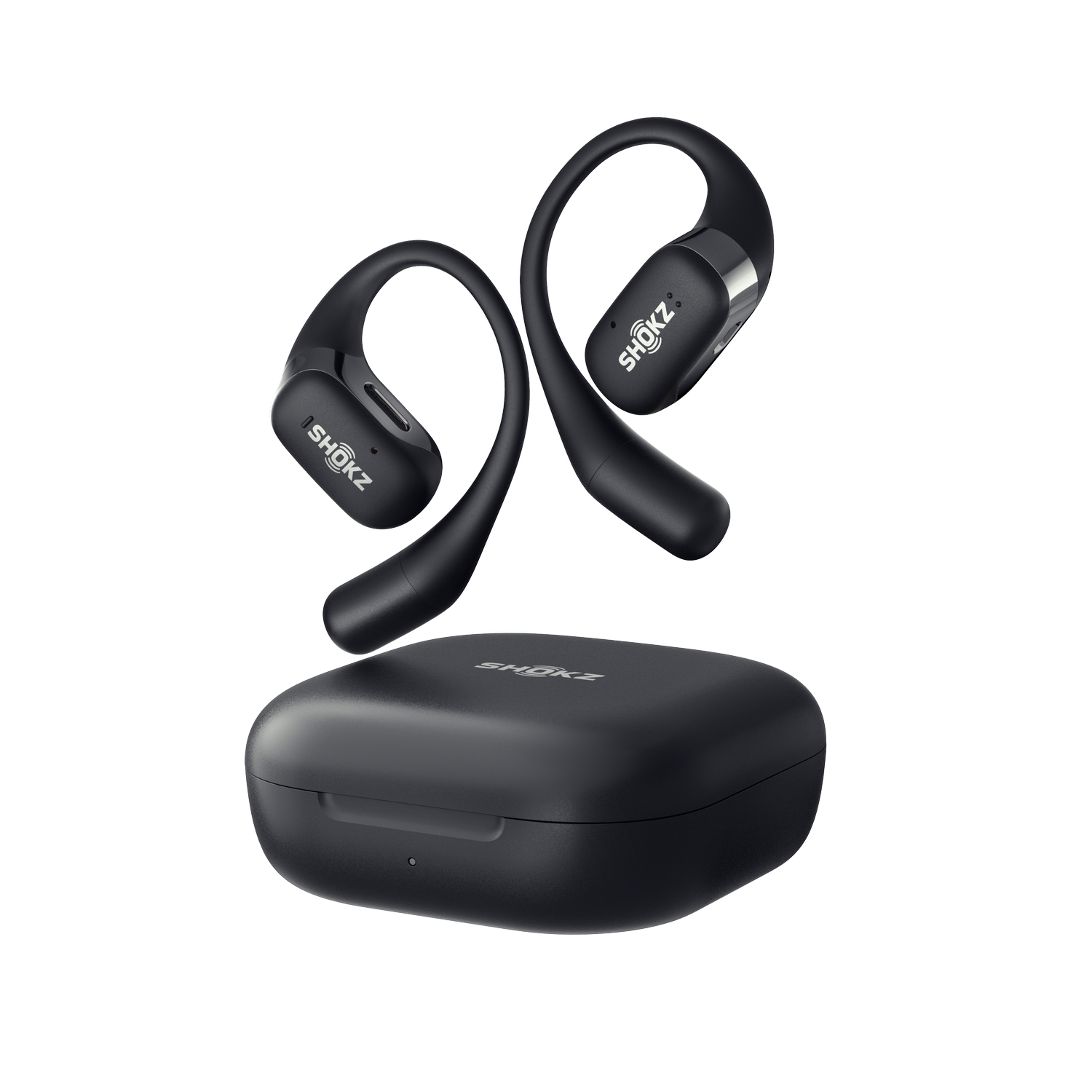 Black Shokz headphones and charging case. The background is black.