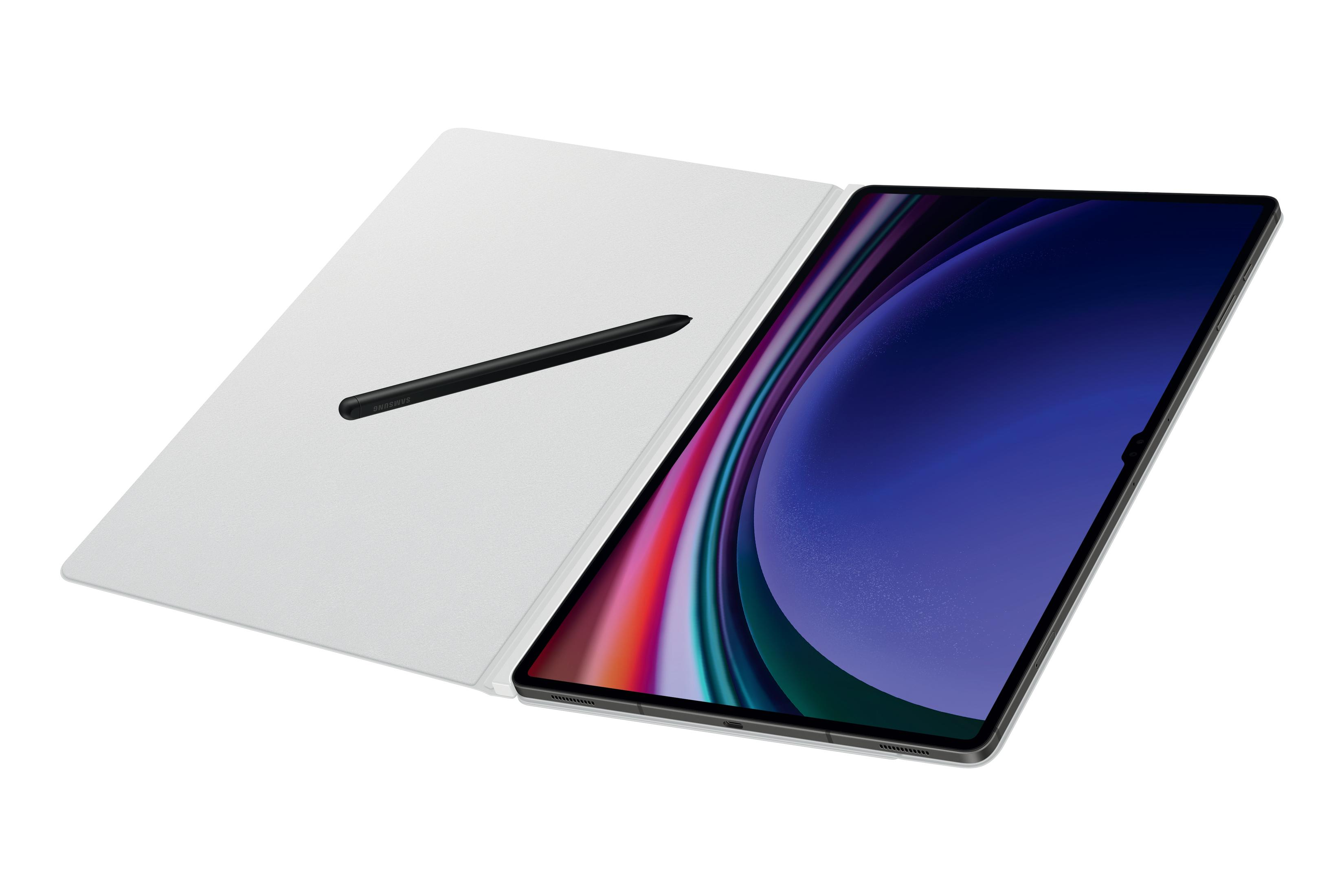 Tablet z czarnym rysikiem na białej okładce, otwarty na białym tle. Fioletowy i różowy ekran.