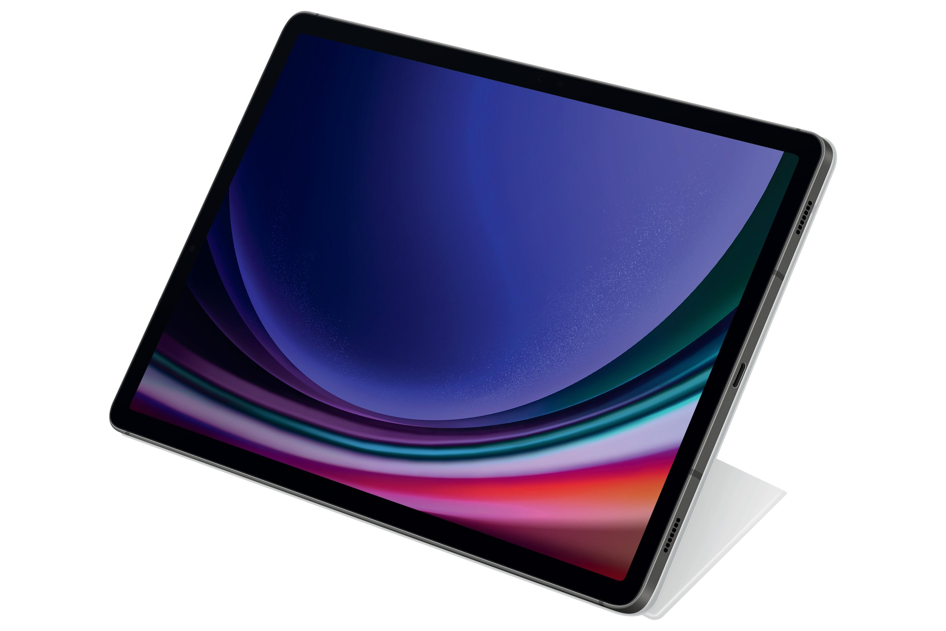 Tablet, pod kątem, ekran wyświetlający kolorową sztukę abstrakcyjną, srebrna ramka.