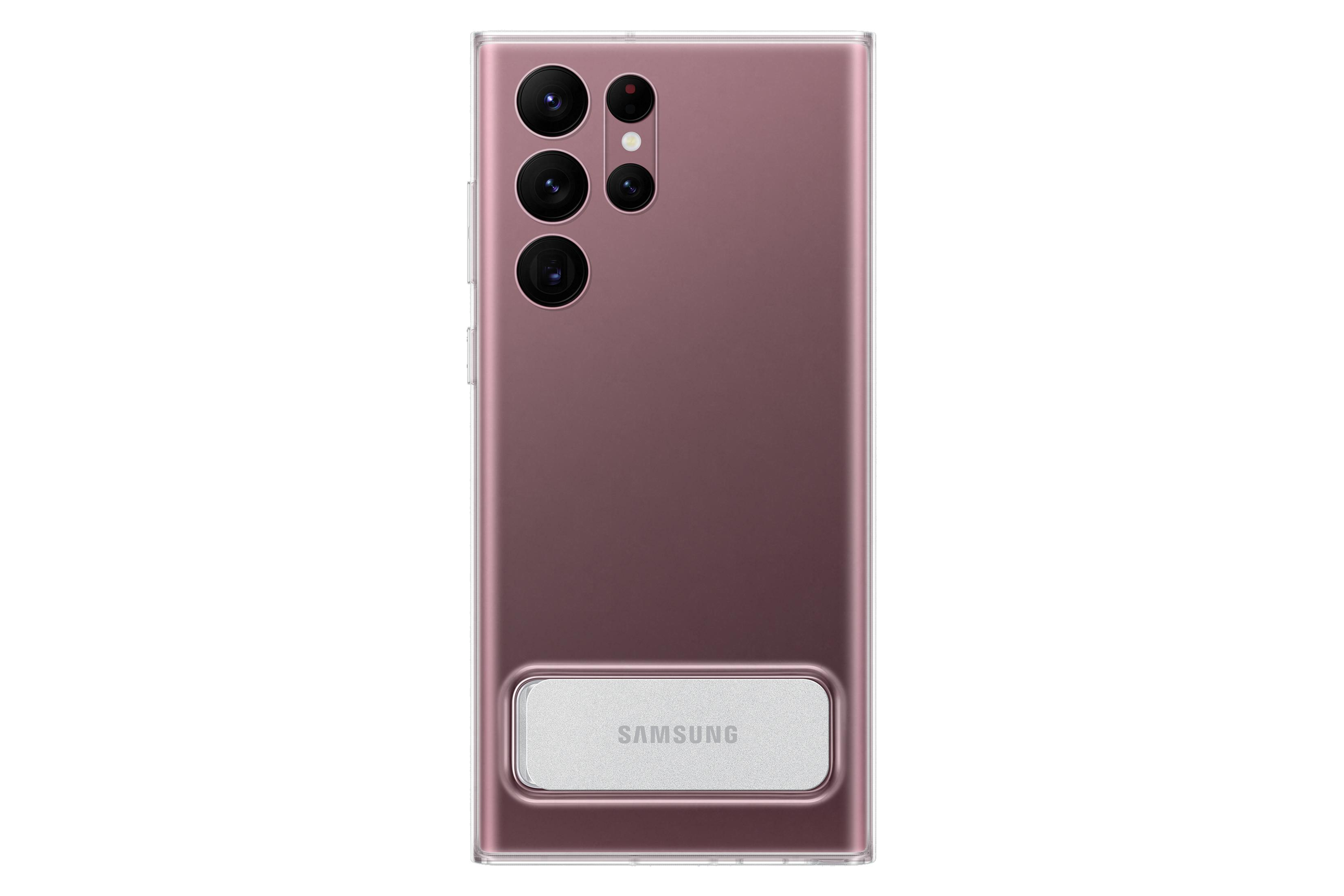 Telefono con custodia rosata e cavalletto argentato. Logo Samsung. Sfondo bianco.