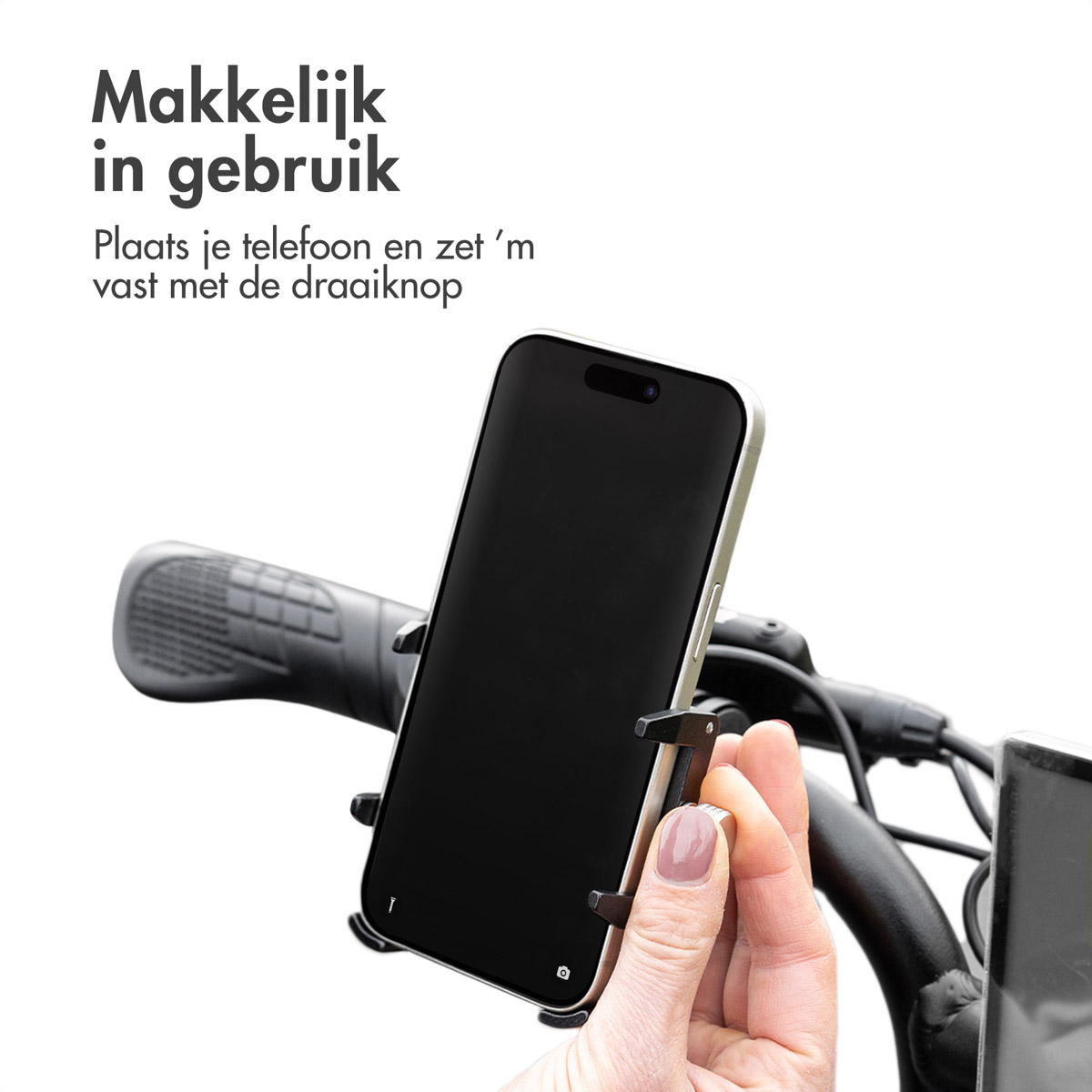 A phone is secured in a mount on a bicycle handlebar.