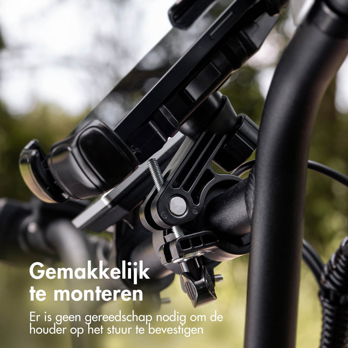 A black bicycle phone holder is attached to a handlebar.
