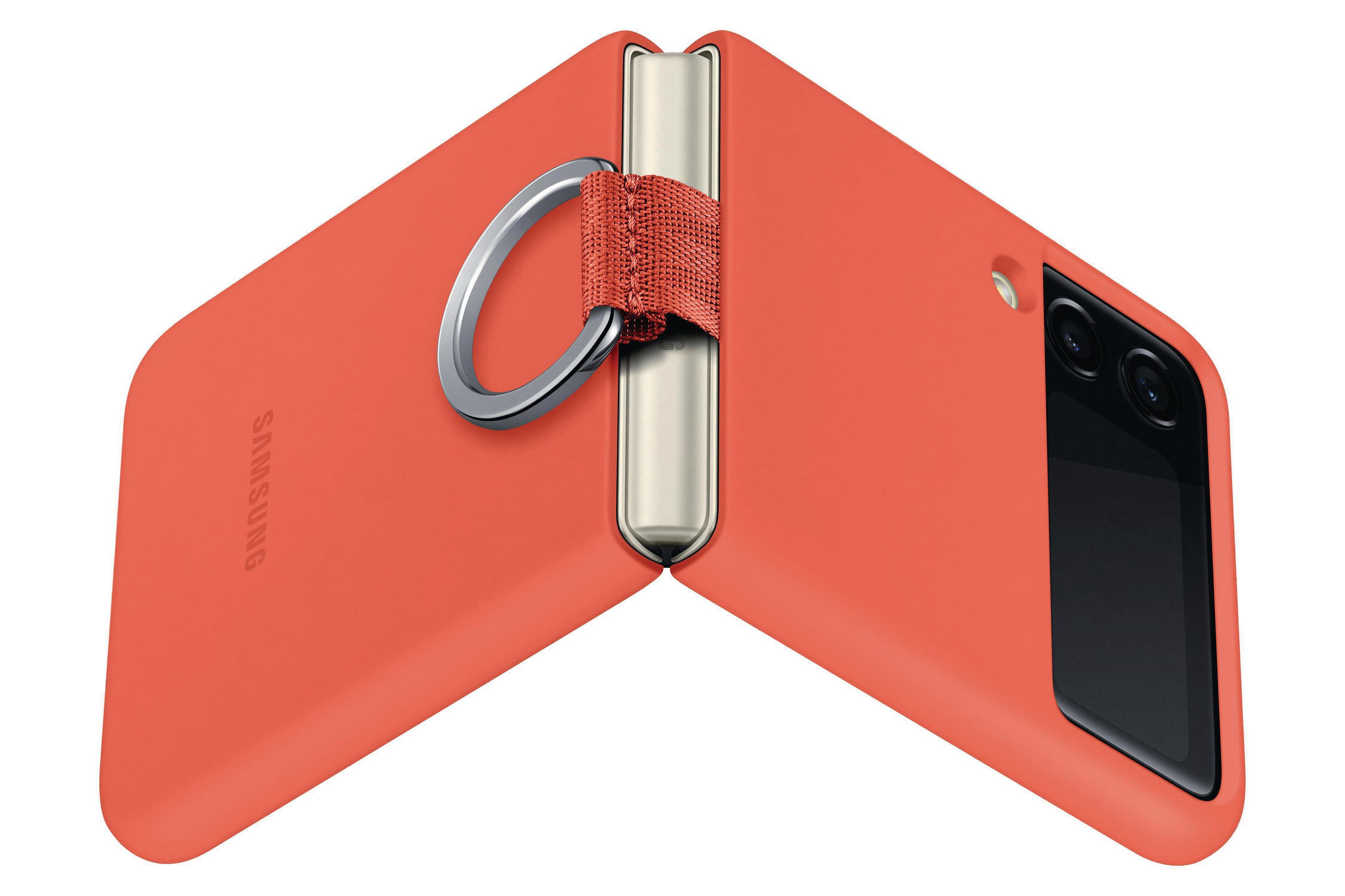 Gefaltete korallenfarbene Handyhülle mit Ringhalter. Zeigt Rückkamera und Samsung-Logo.
