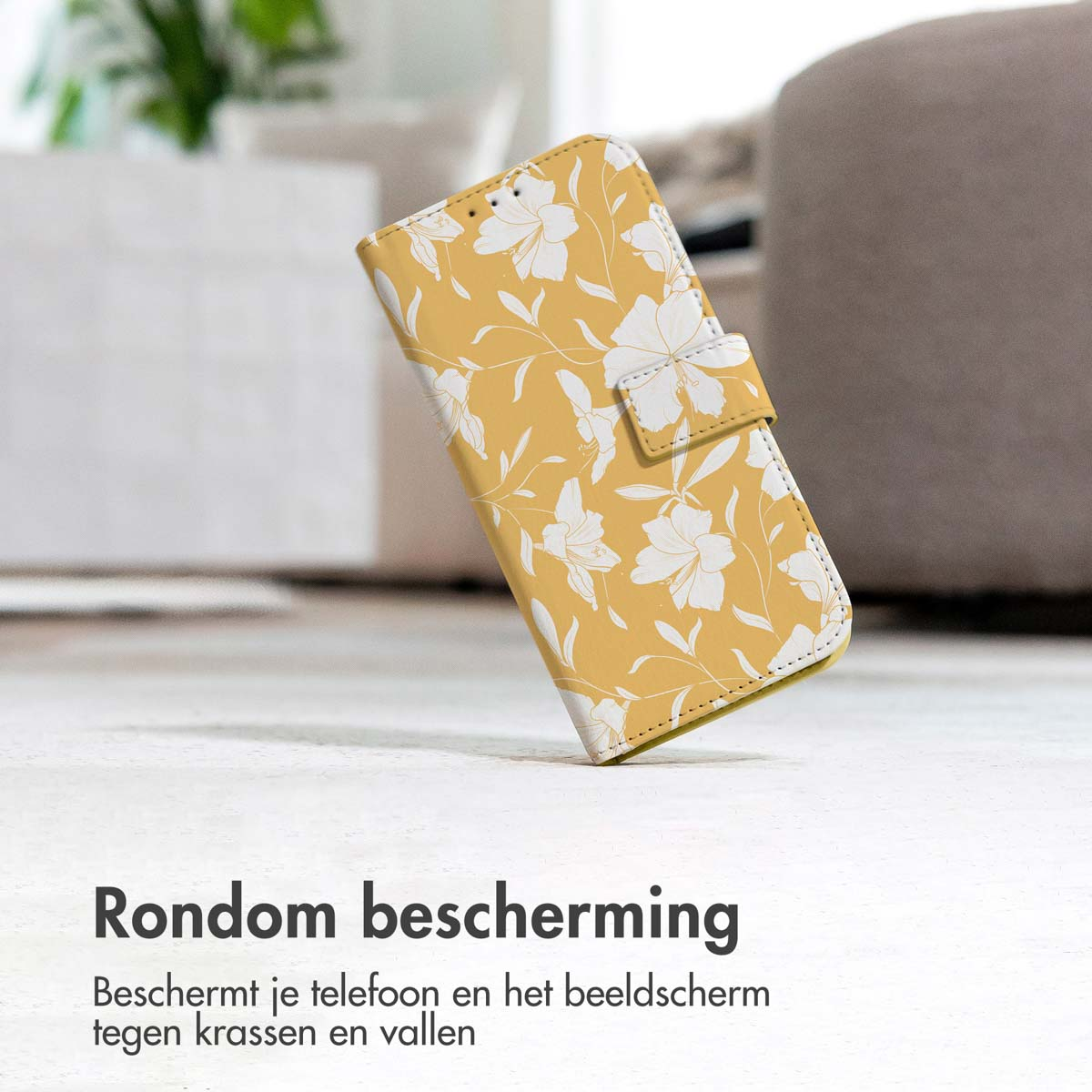 Gele bloemen telefoonhoes op de vloer. Tekst: Allround bescherming. Beschermt uw telefoon en scherm.