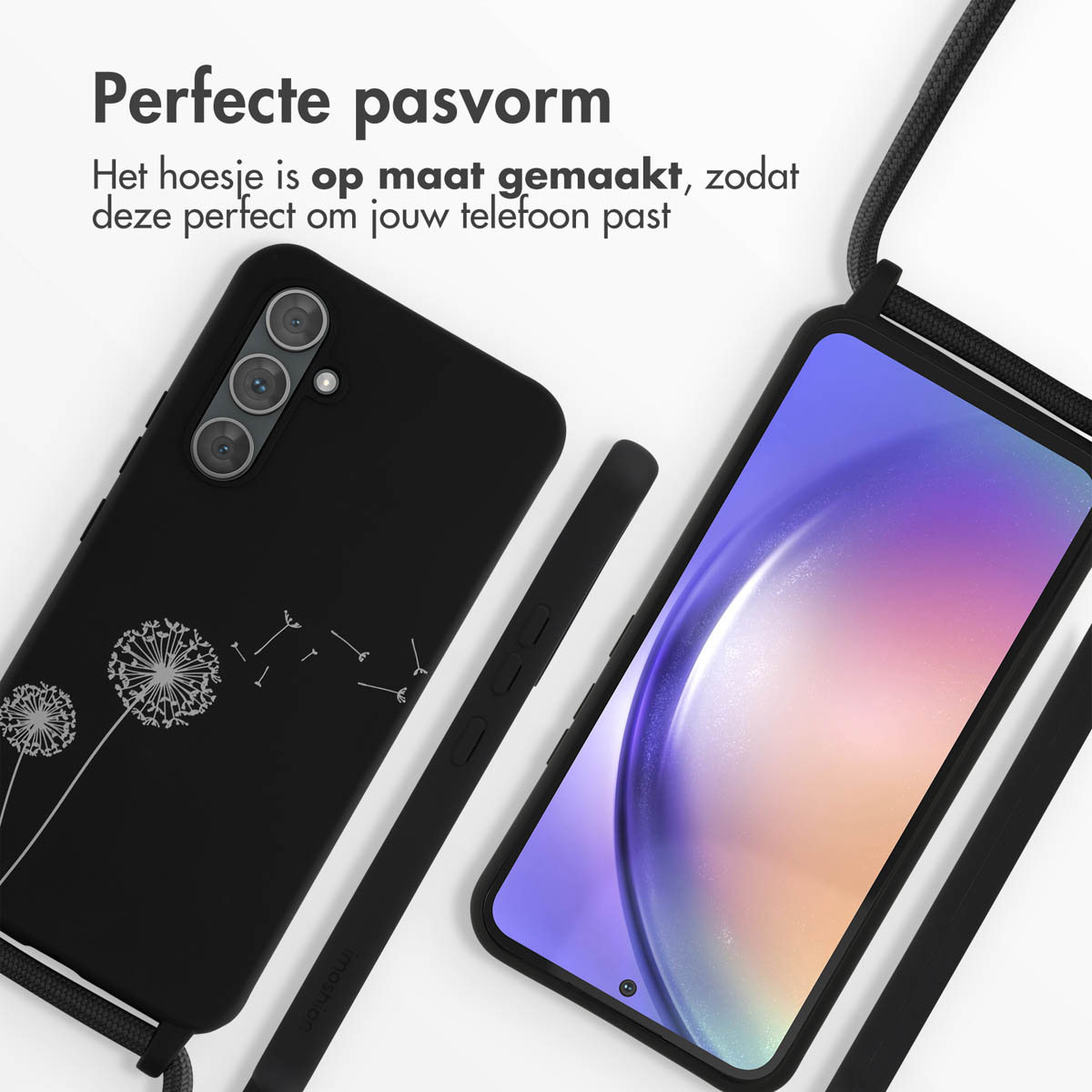 Zwarte telefoonhoes met paardenbloemdesign en koord, naast een smartphone.