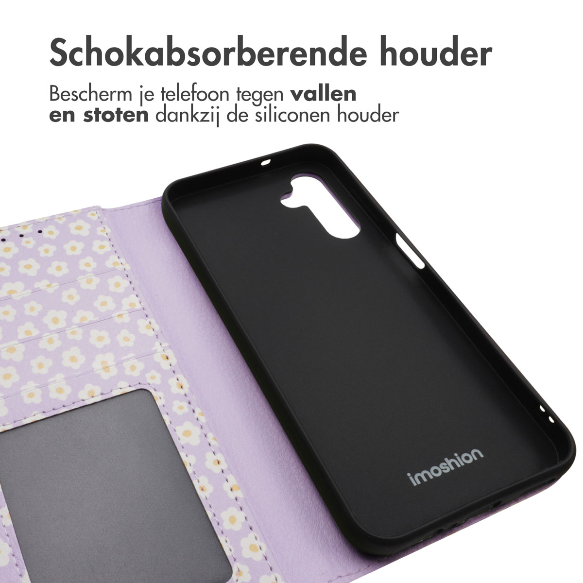 Une coque de téléphone noire repose sur une coque violette à motif floral.