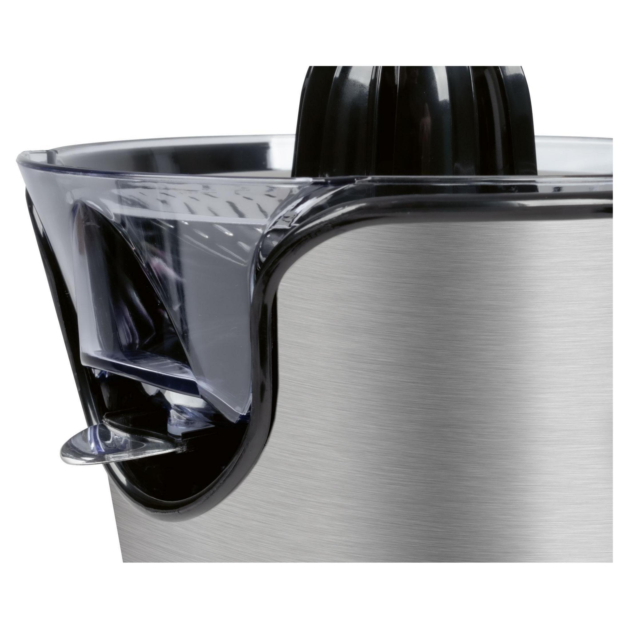 Zbliżenie wyciskarki do cytrusów ze stali nierdzewnej. Ma przezroczystą plastikową górę i czarny rozdrabniacz.