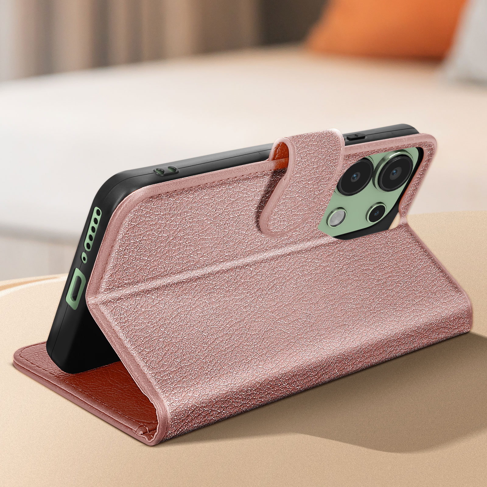 Custodia rosa per telefono aperta, mostra il telefono con le lenti della fotocamera e uno slot per schede.