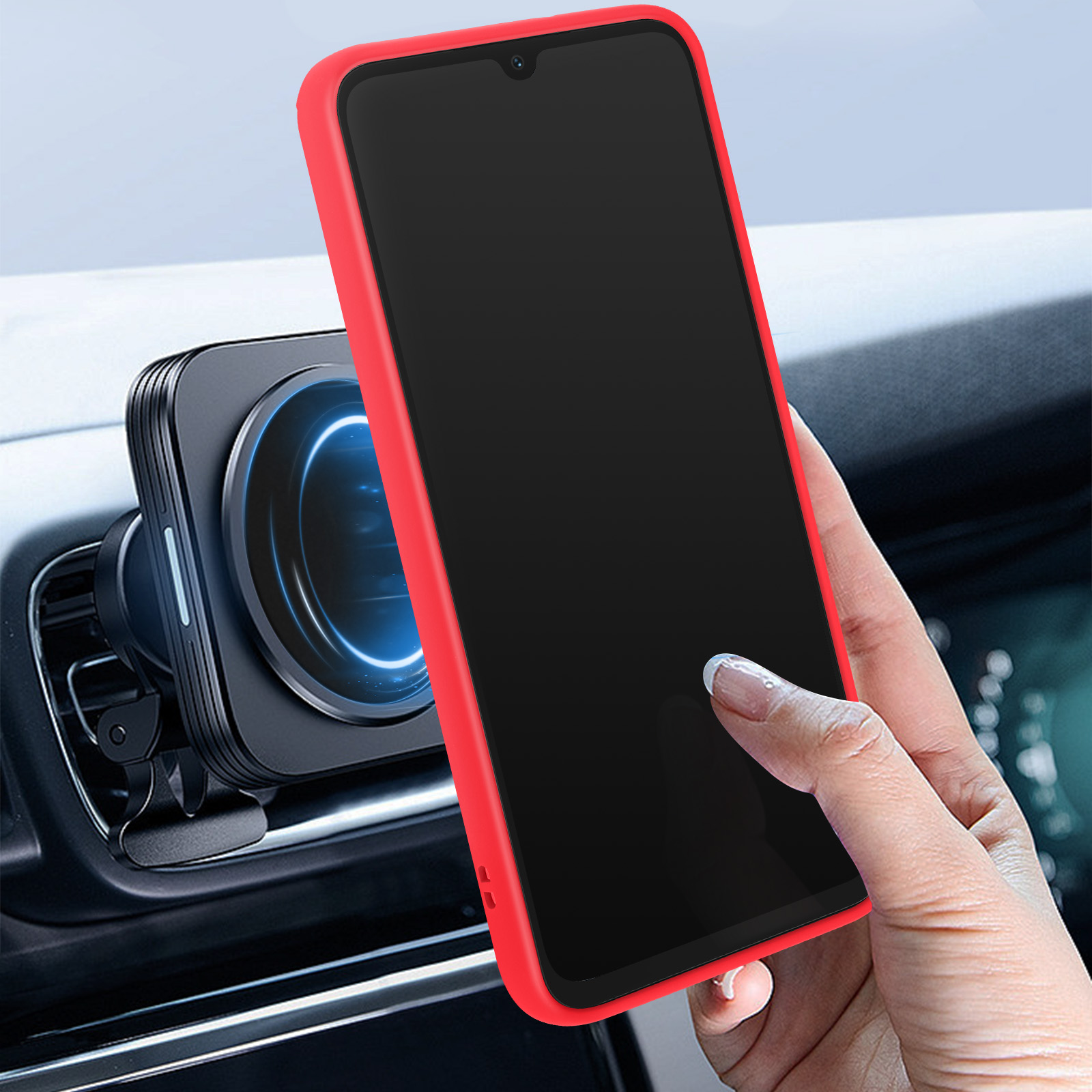 Un telefono rosso in un supporto per auto. Una mano afferra il telefono.