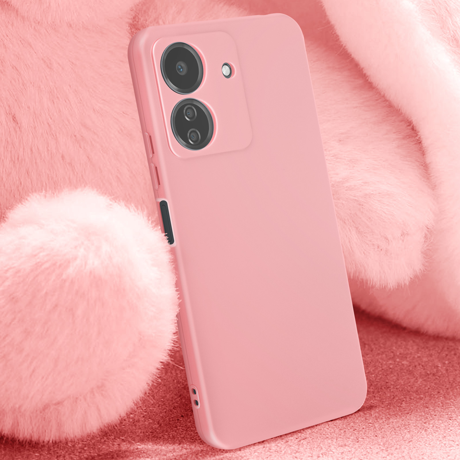 Custodia rosa per telefono con lenti della fotocamera, su sfondo rosa soffice.