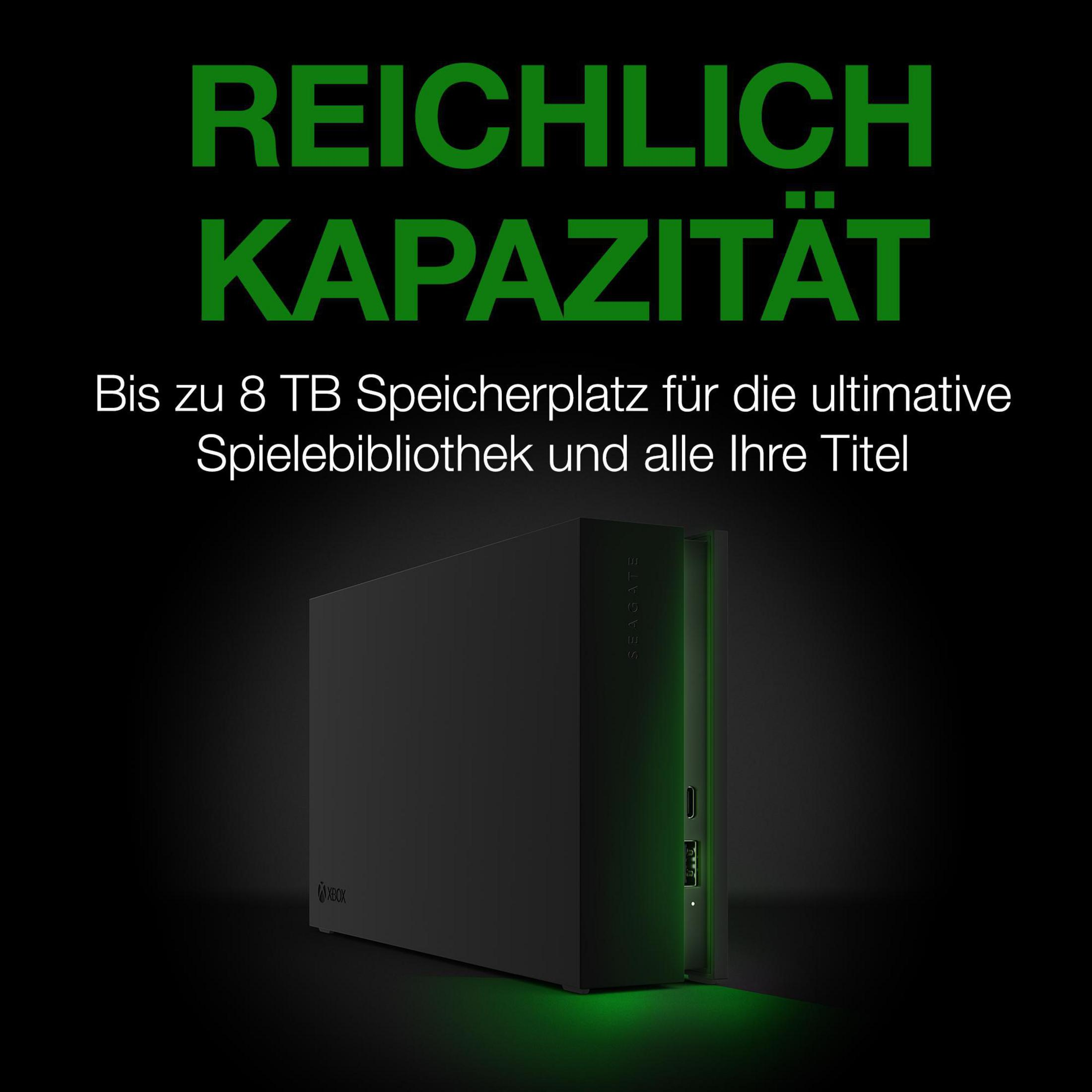 Czarny zewnętrzny dysk twardy z zielonym tekstem 'REICHLICH KAPAZITÄT'.