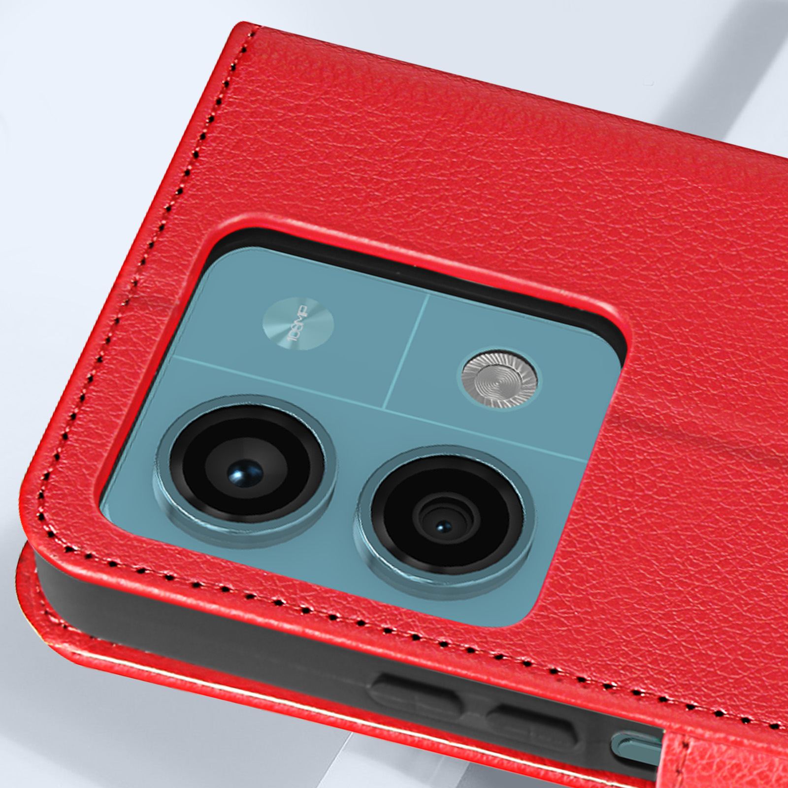 Custodia rossa aperta che rivela la configurazione della fotocamera del telefono e il retro azzurro.
