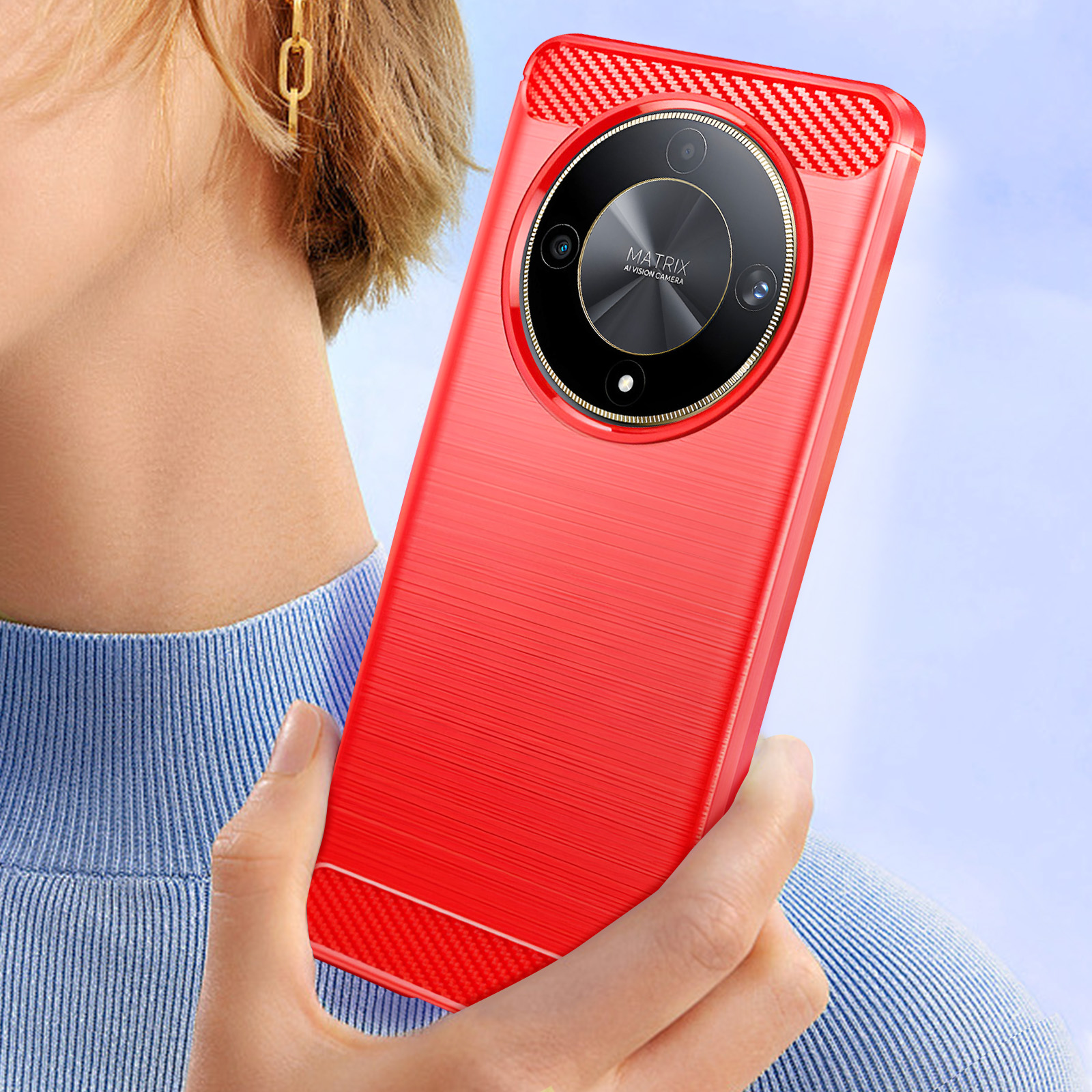 Custodia per telefono rossa tenuta in mano. Mostra le fotocamere, con una cornice dorata glitterata.