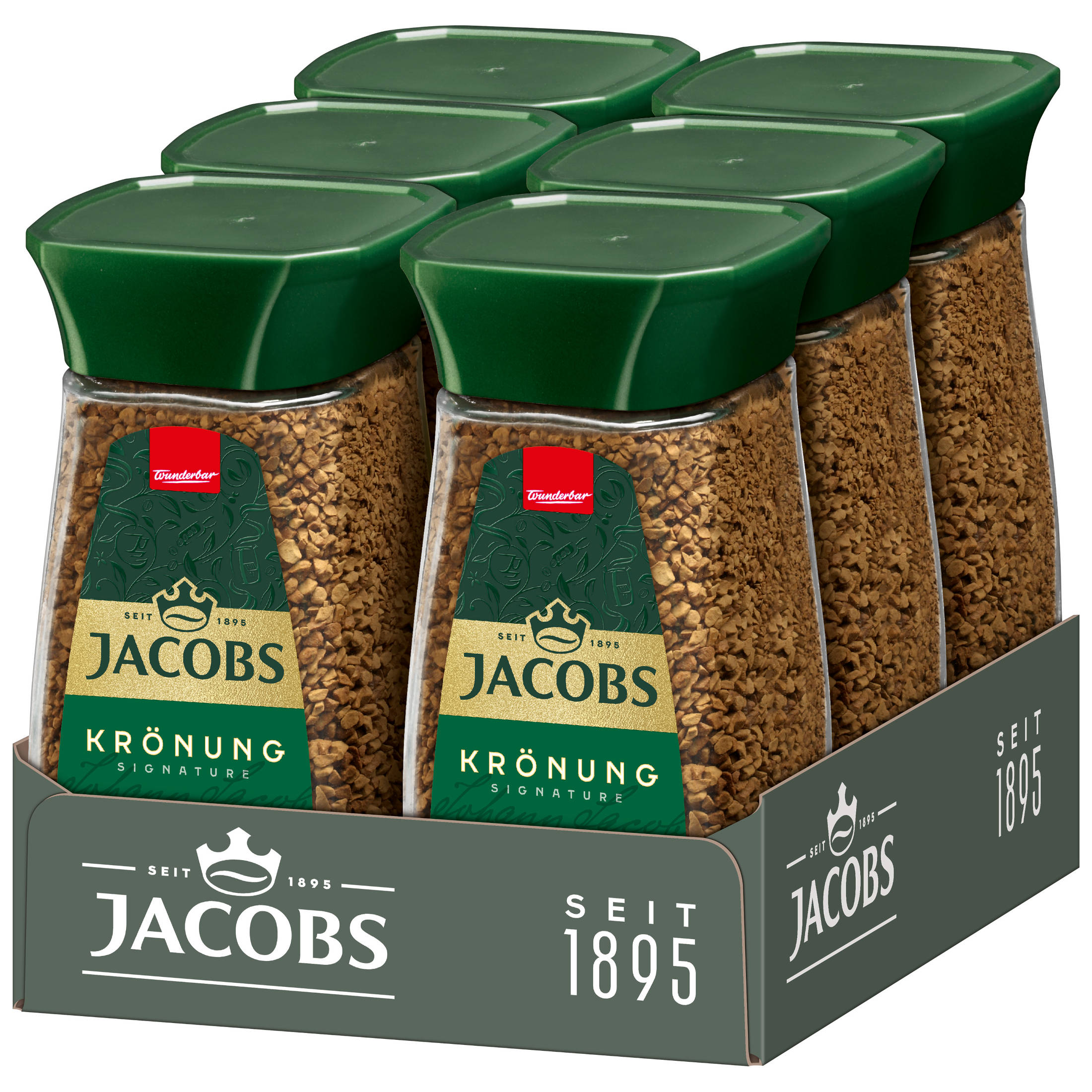 Sechs Gläser Jacobs Krönung Kaffee mit grünen Deckeln in einer Jacobs-Markenbox.