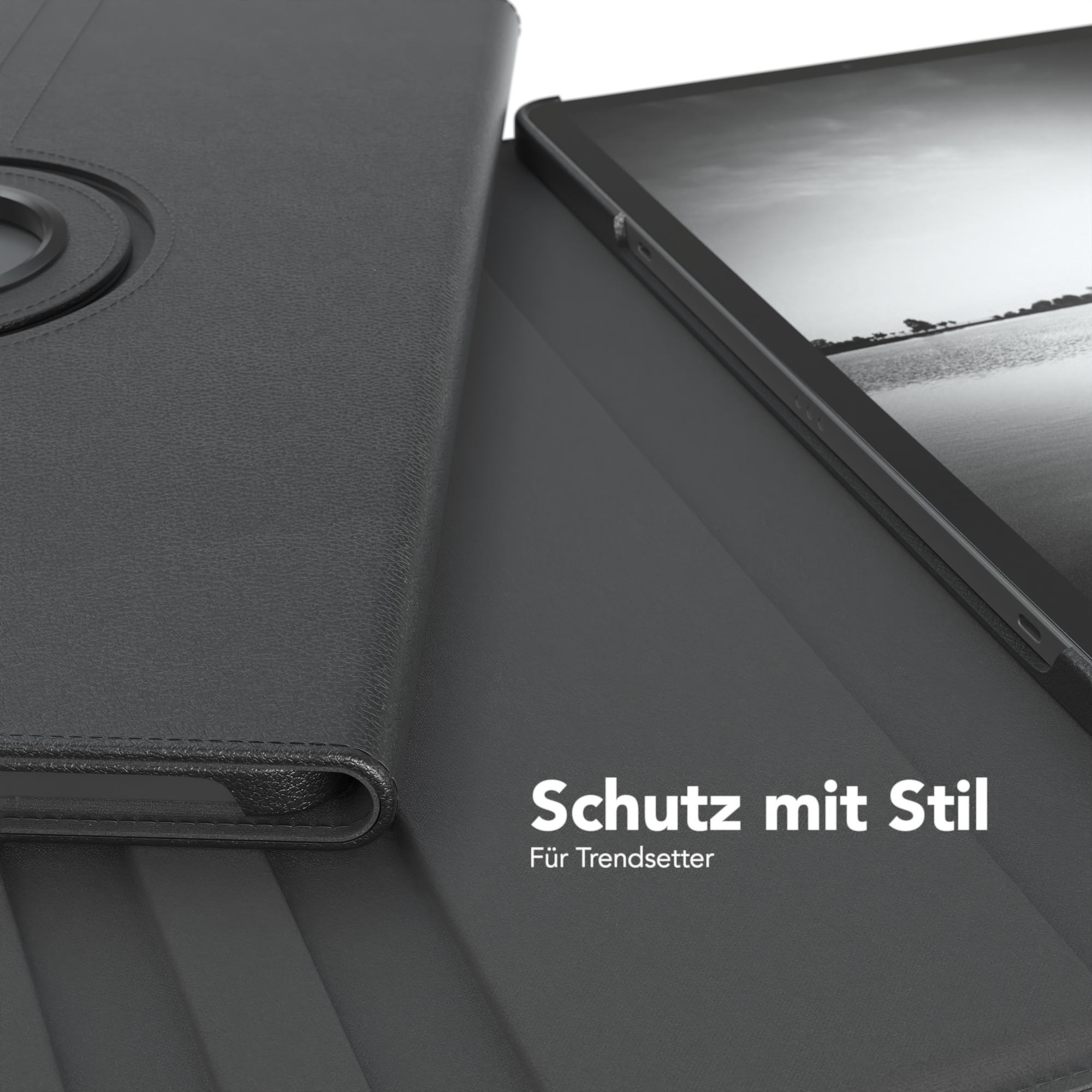 Schwarze Tablethülle mit Text auf schwarzem Hintergrund und Tablet darin.