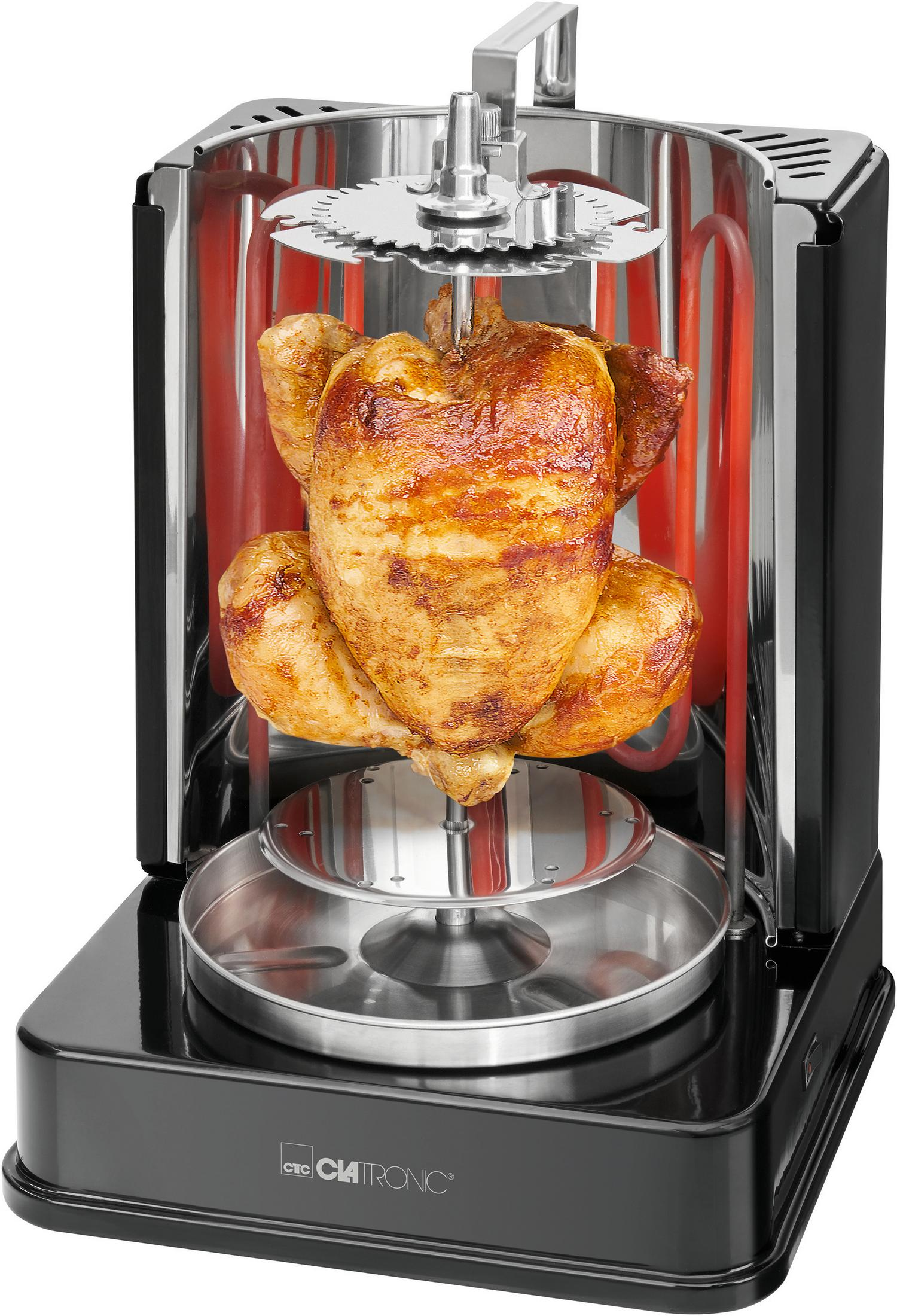 Piekarnik obrotowy z upieczonym kurczakiem w środku. Widoczne czerwone elementy grzewcze.