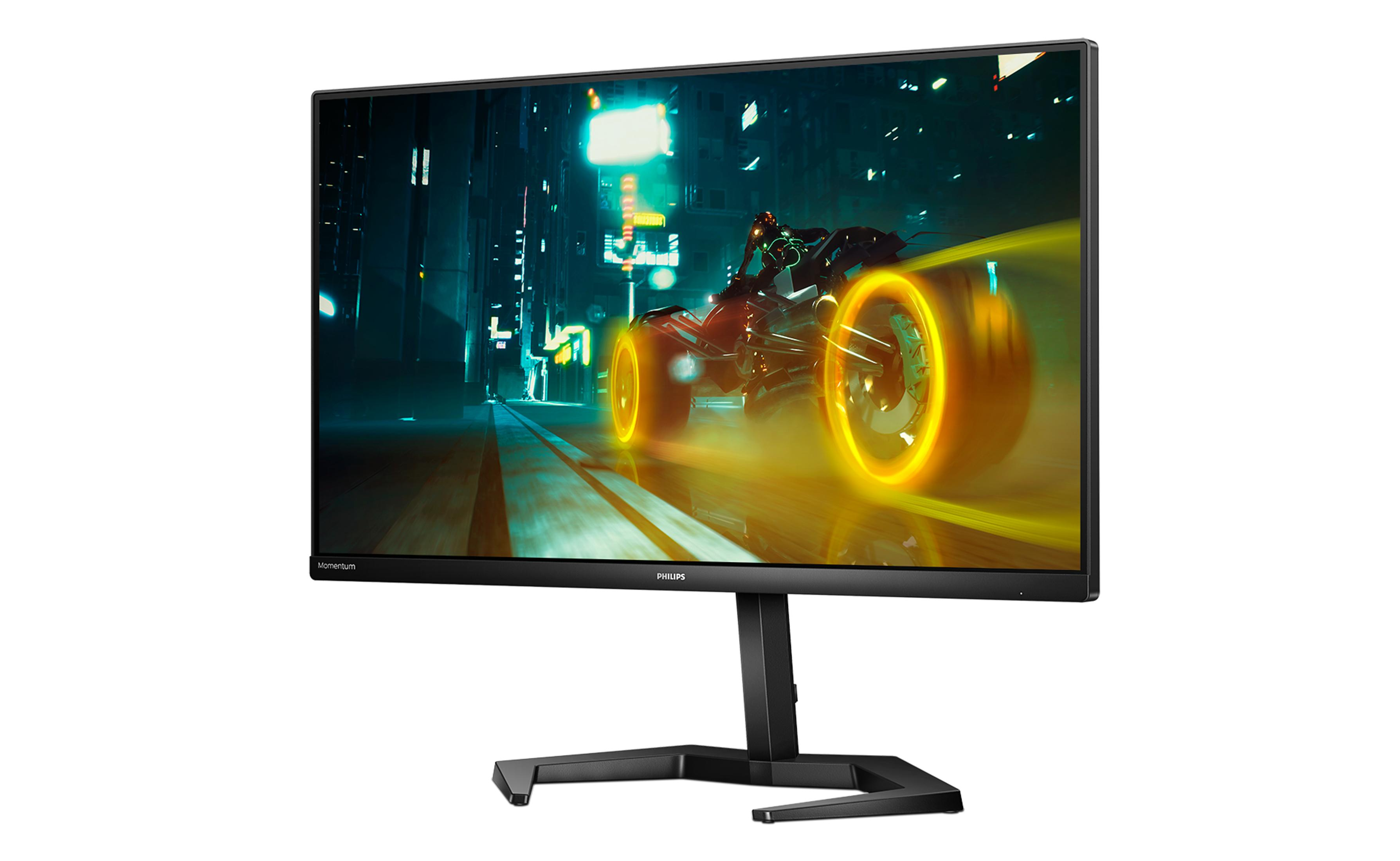 Czarny monitor do gier wyświetla futurystyczny wyścig samochodowy na nocnym torze miejskim.