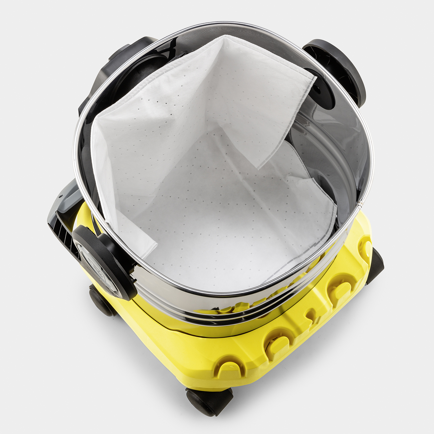 Żółty i srebrny odkurzacz. Wewnątrz widać biały worek filtracyjny.