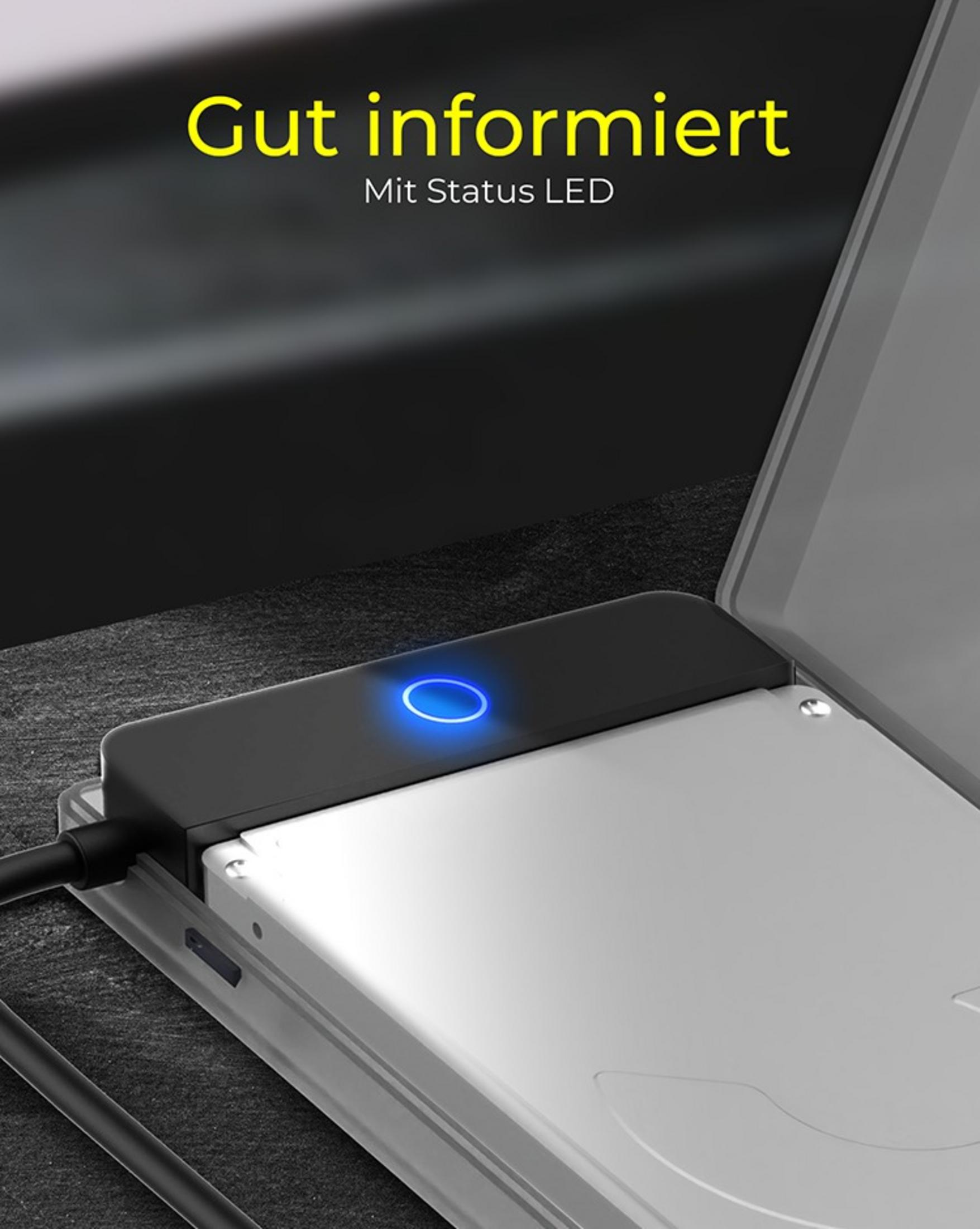 Nahaufnahme eines schwarzen Festplattengehäuses mit blauer LED. Der Text 'Gut informiert' ist darüber sichtbar.