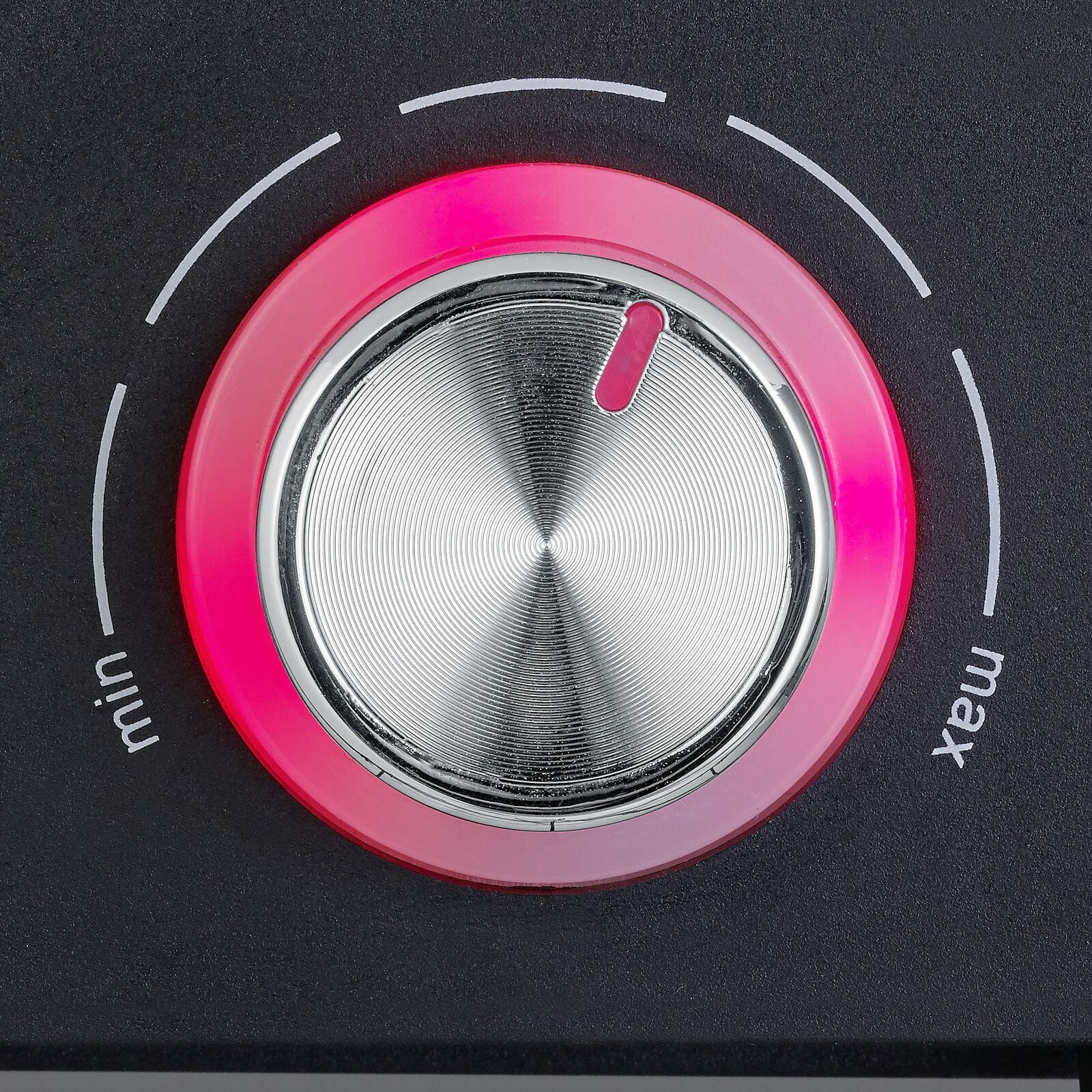 Close up of a knob with min and max markings. Pink light around the knob.