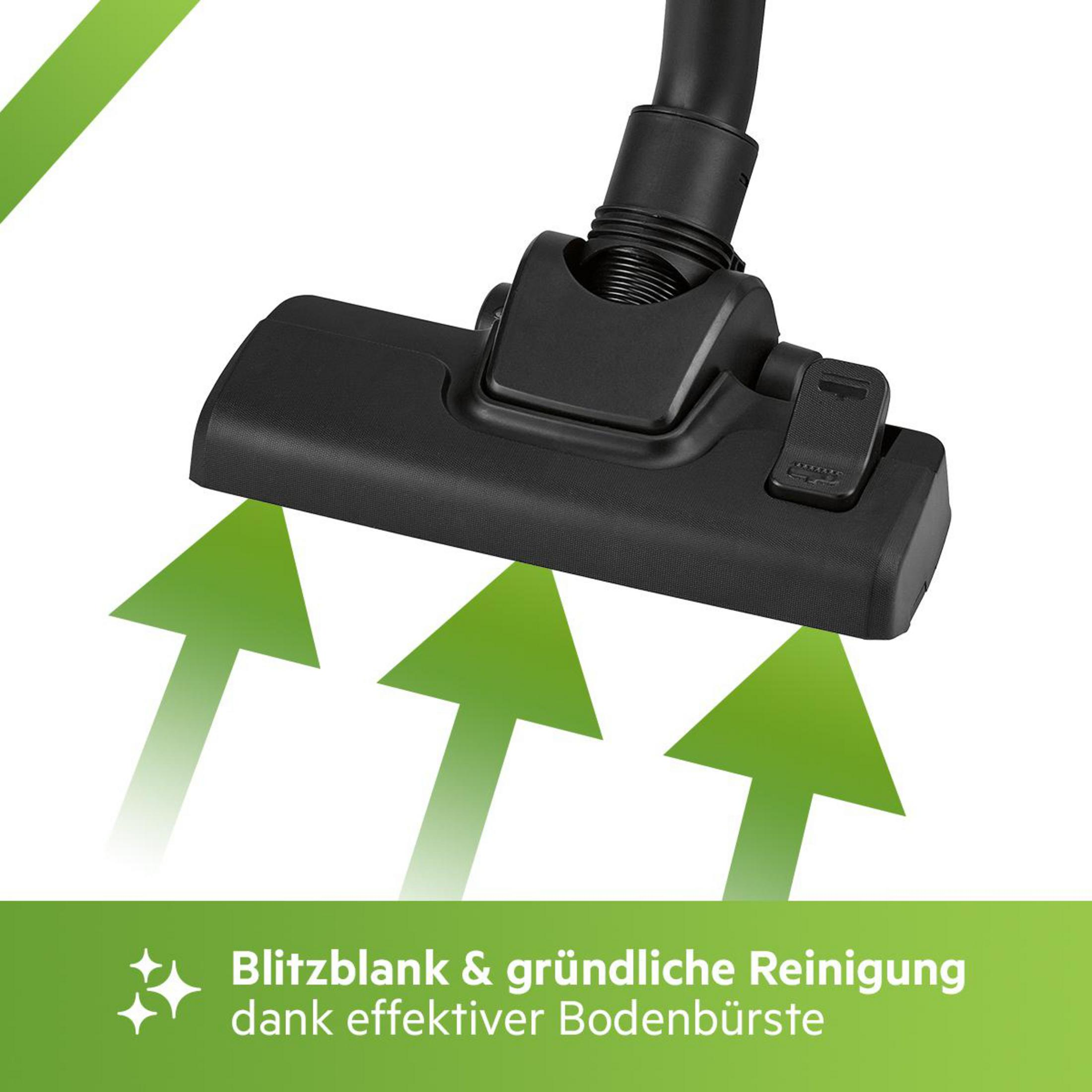 Czarna głowica odkurzacza z zielonymi strzałkami wskazującymi kierunek czyszczenia.