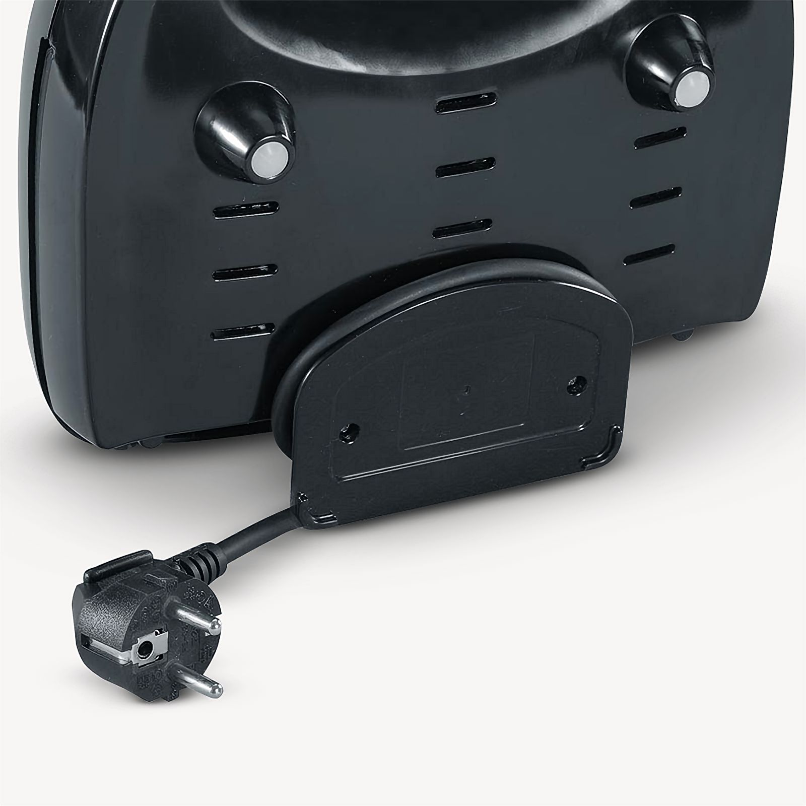 The back of a black appliance, with a power cord and plug.