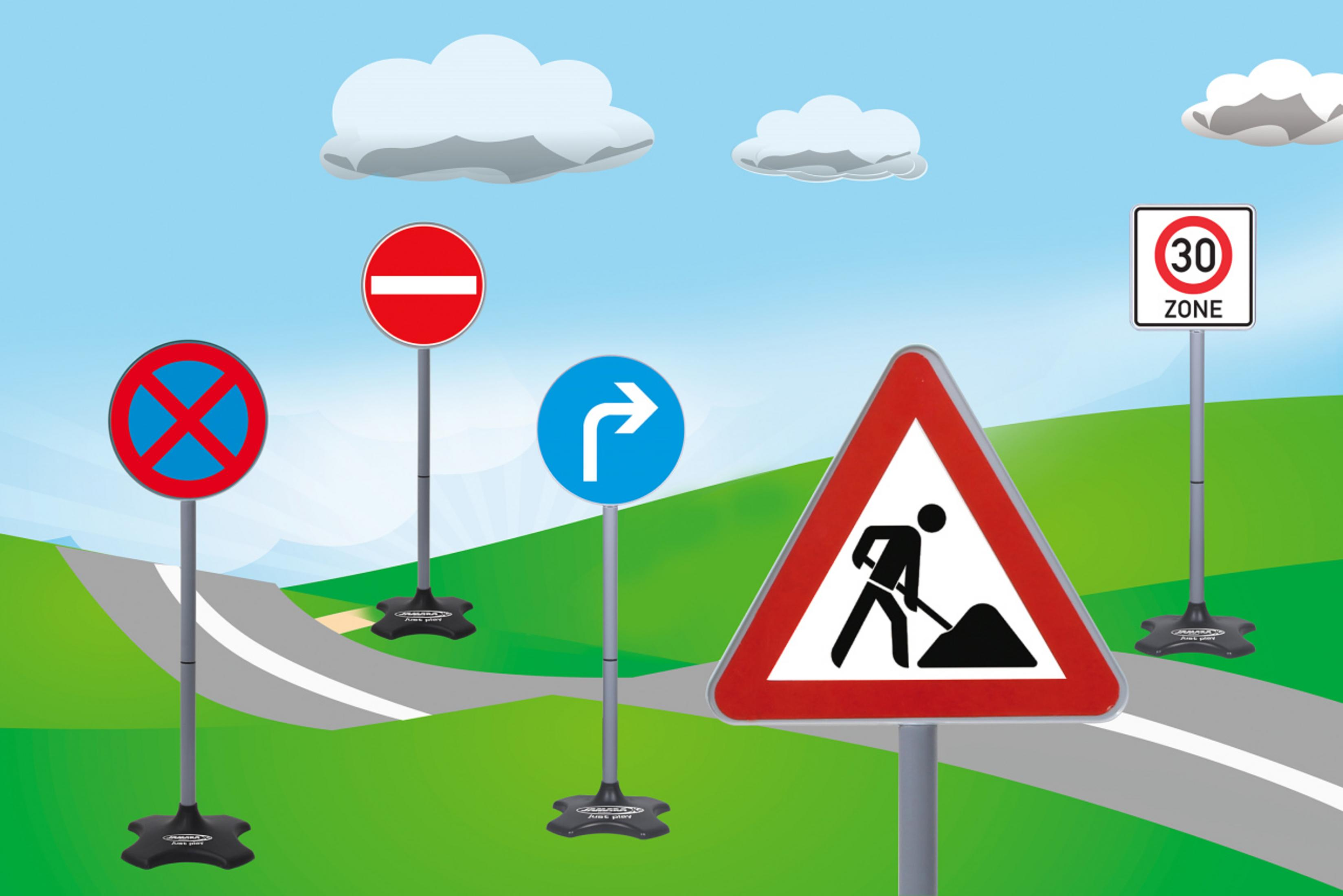 Znaki drogowe na zielonym polu, w tym zakaz wjazdu, skręt w prawo, zakaz parkowania i znak robót drogowych.