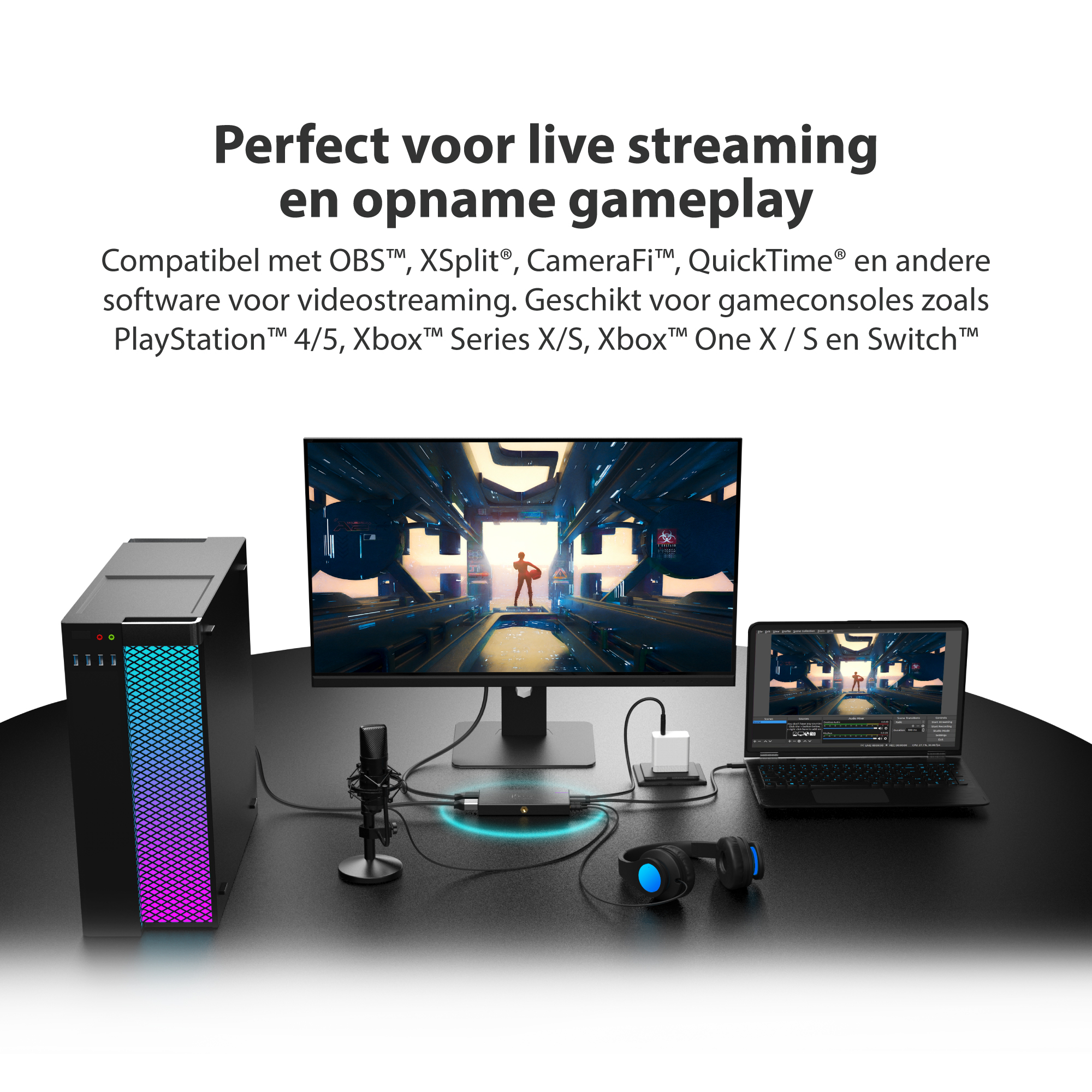 Konfiguracja z komputerem, monitorem pokazującym grę, laptopem, mikrofonem i słuchawkami. Czarne tło.