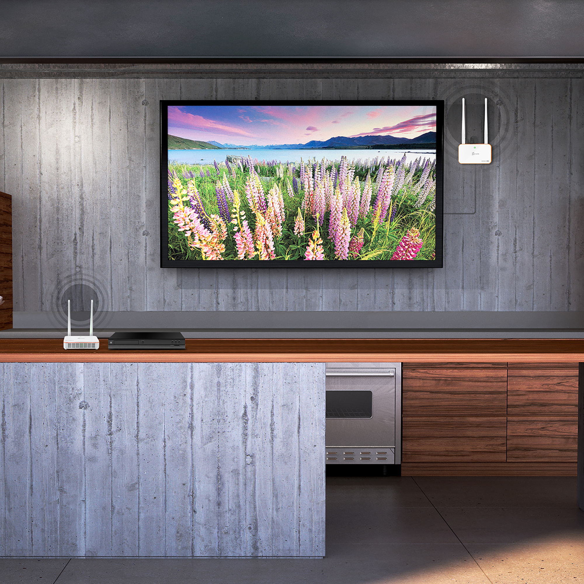 Ein Fernseher zeigt eine Landschaft. Ein weißer Router ist an der Wand montiert, ein Server darunter.