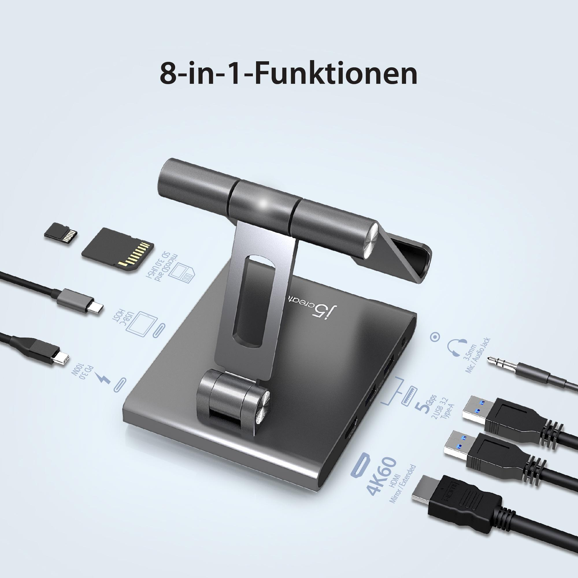Ein silberner Multi-Port-Adapter mit verschiedenen angeschlossenen Geräten, darunter USB, SD-Karte und HDMI.