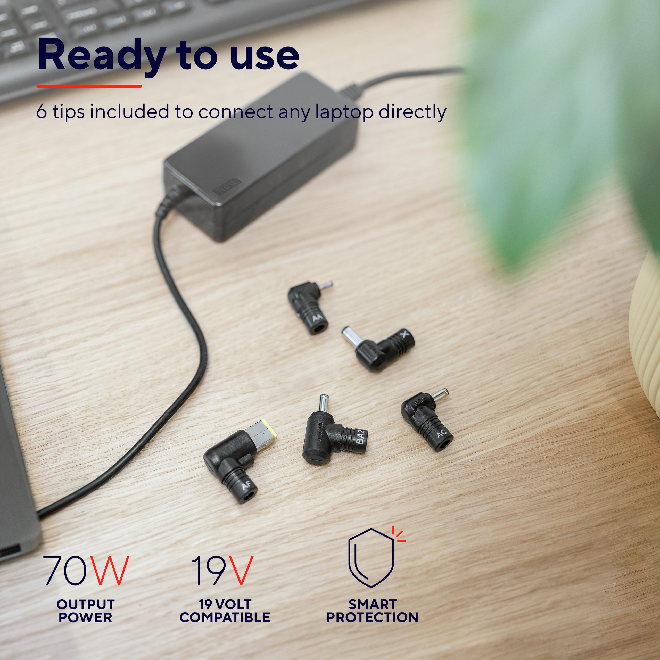 Adaptateur secteur pour ordinateur portable avec embouts. Plusieurs embouts sont affichés. Texte indique puissance.