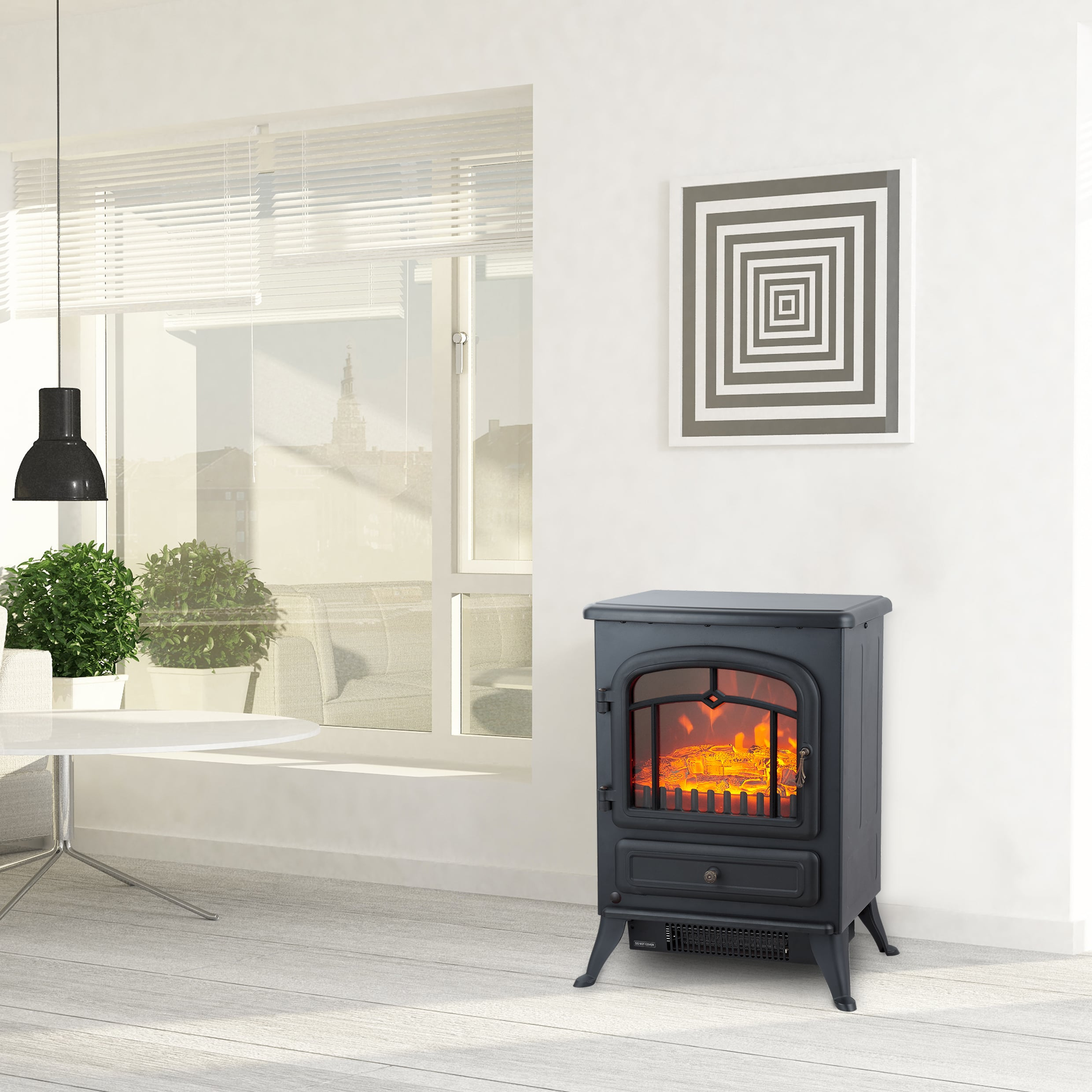 Black electric fireplace in a room with a painting and a table.