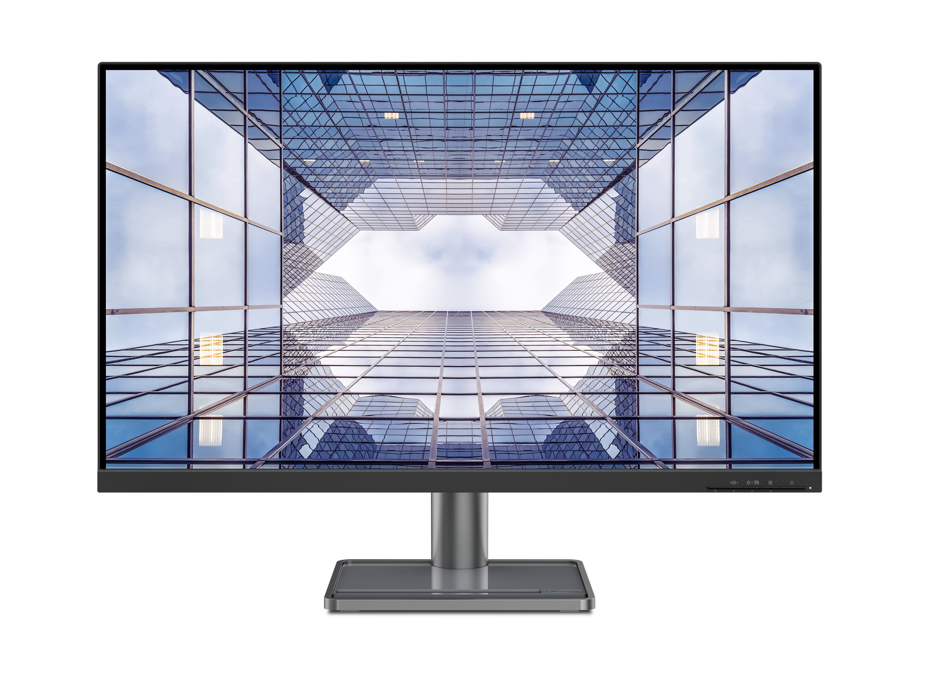 Monitor komputera z odbiciem budynku na ekranie. Monitor stoi na szarej podstawie.