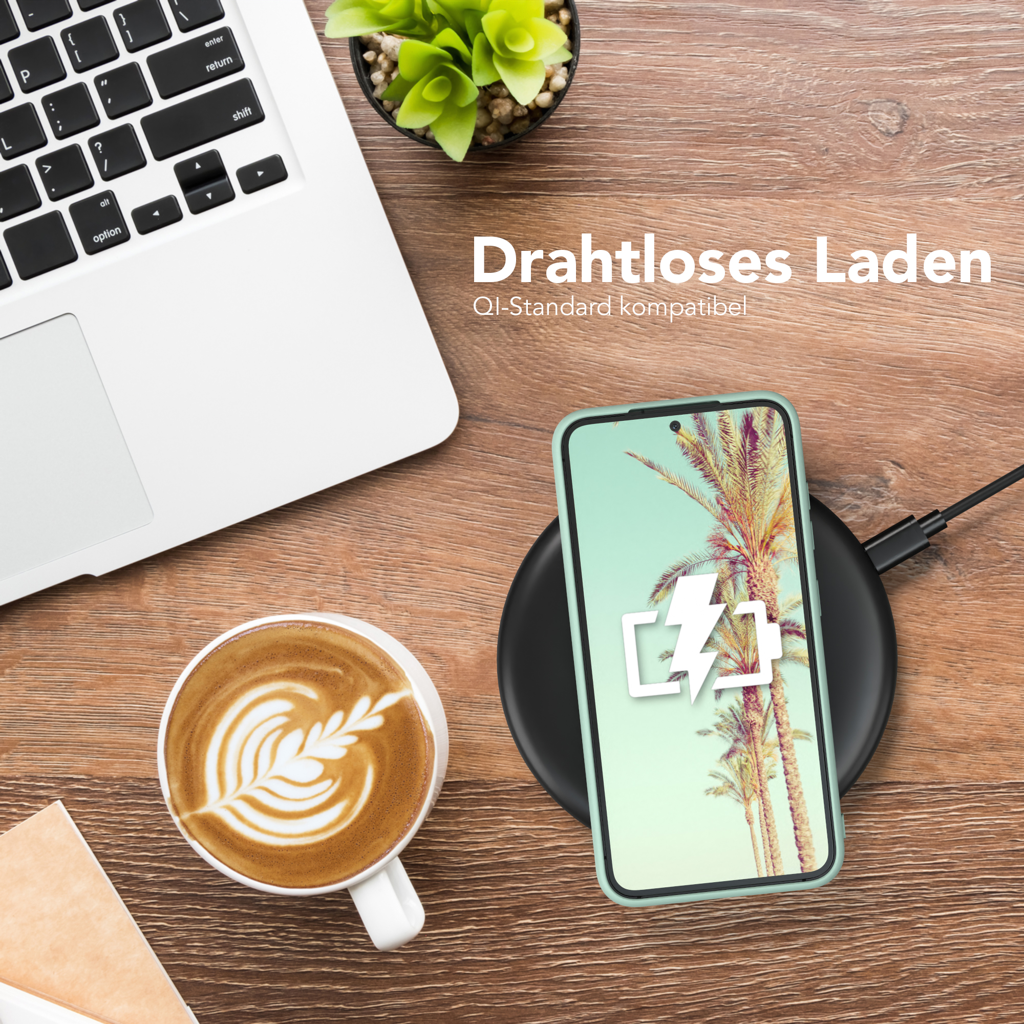 Ein Telefon auf einem kabellosen Ladegerät, neben einer Tasse Kaffee und einem Laptop. Text zeigt kabelloses Laden an.