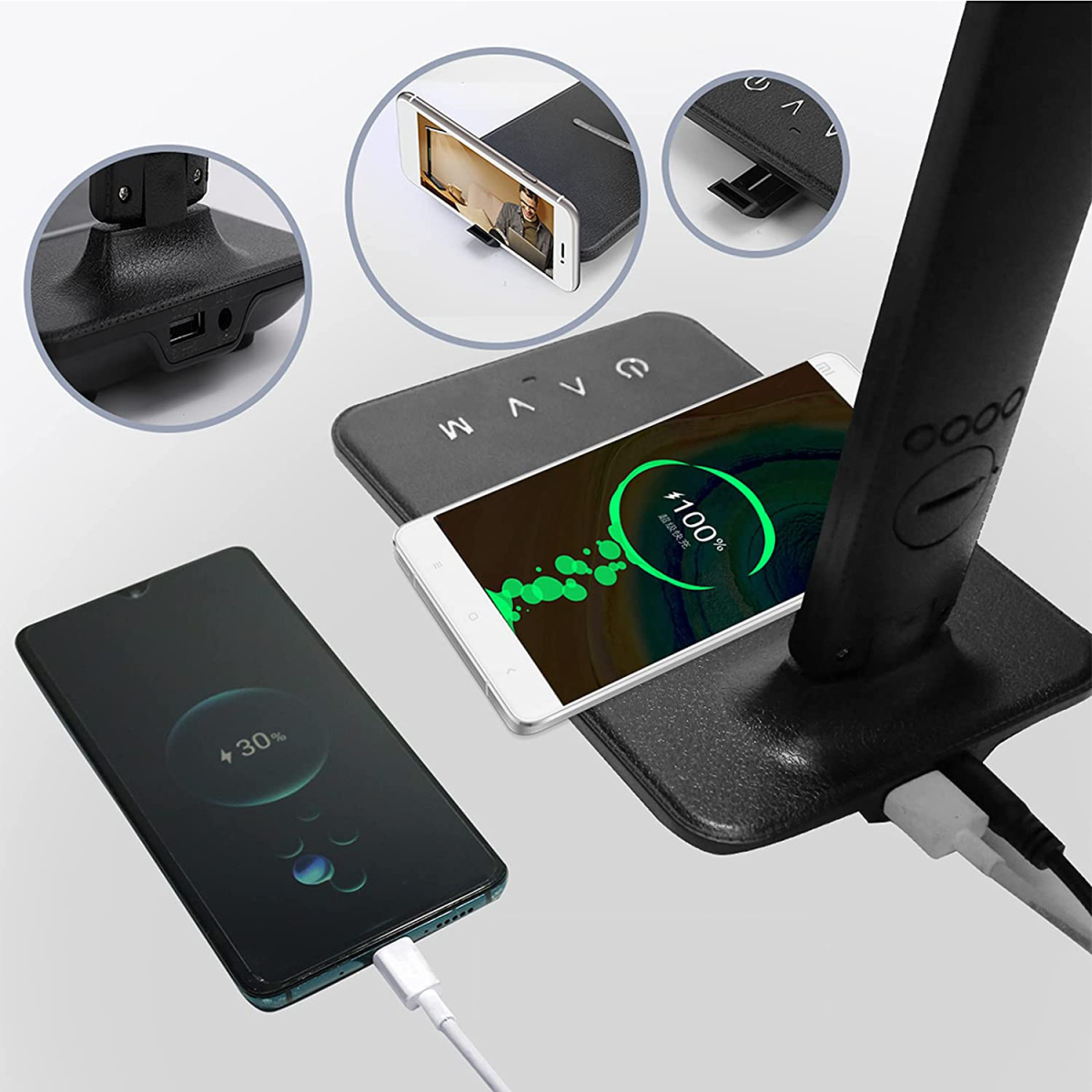 Telefone, die auf einer kabellosen Ladestation aufgeladen werden. Ein Telefon zeigt 100% und ein anderes 30% geladen an.