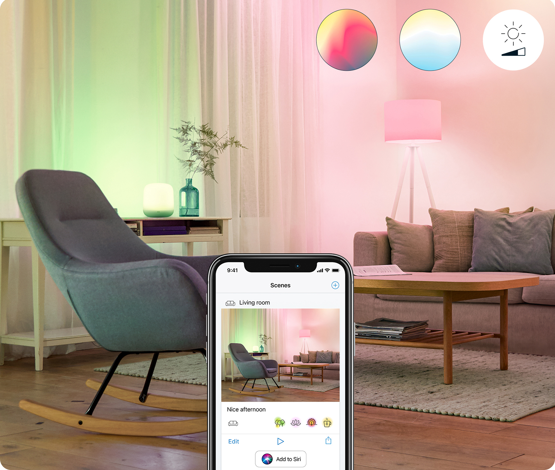 Smartfon pokazujący interfejs aplikacji smart home. Pokój oświetlony kolorowymi światłami. Sofa i krzesło.